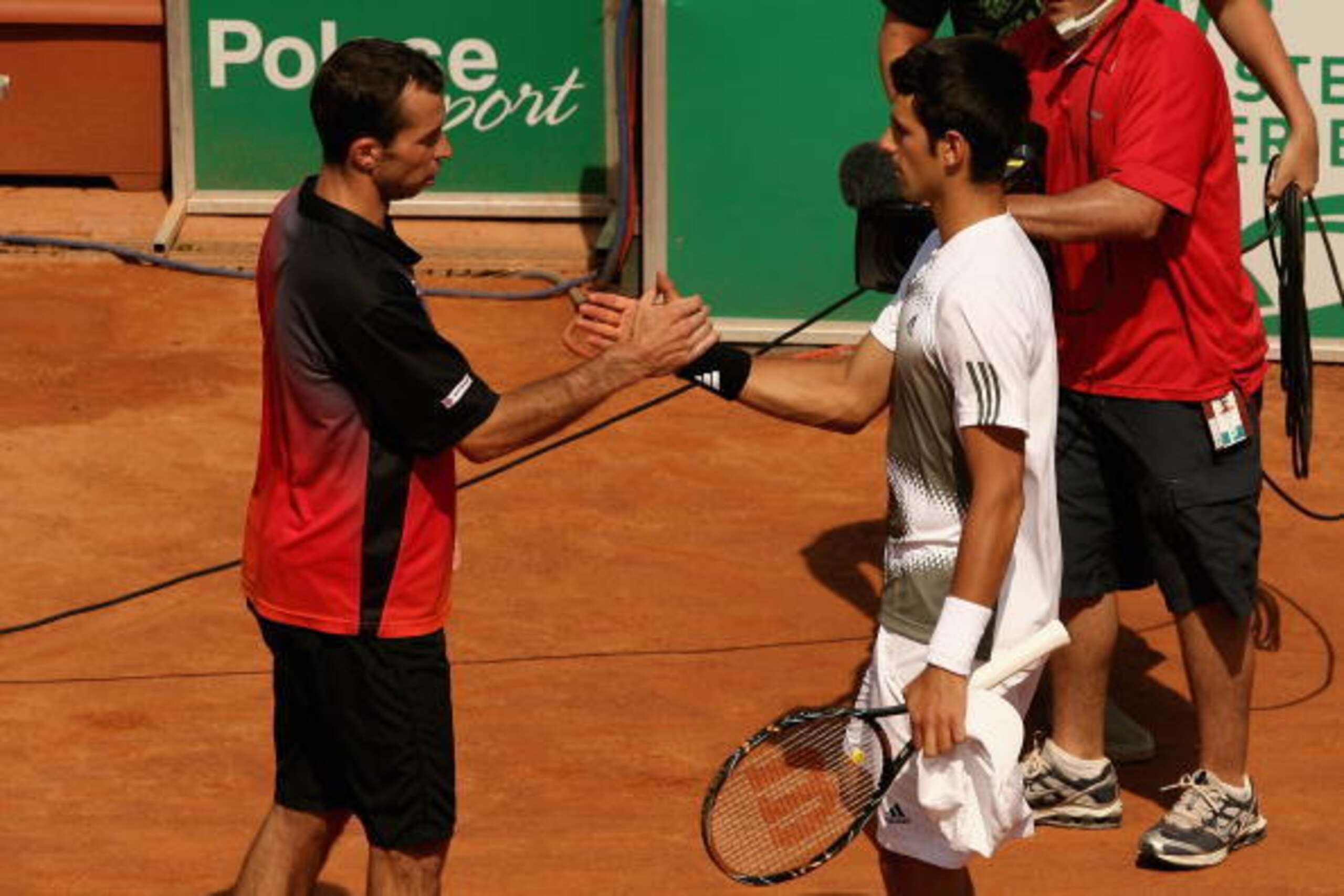 ROME - MAY 10:  Radek Stepanek of the Czech Republic (L) is forced to retire due to feeling sick at the end of the first game of the second set against Novak Djokovic of Serbia during their semi-final match at the ATP Masters Series at the Foro Italico, o
