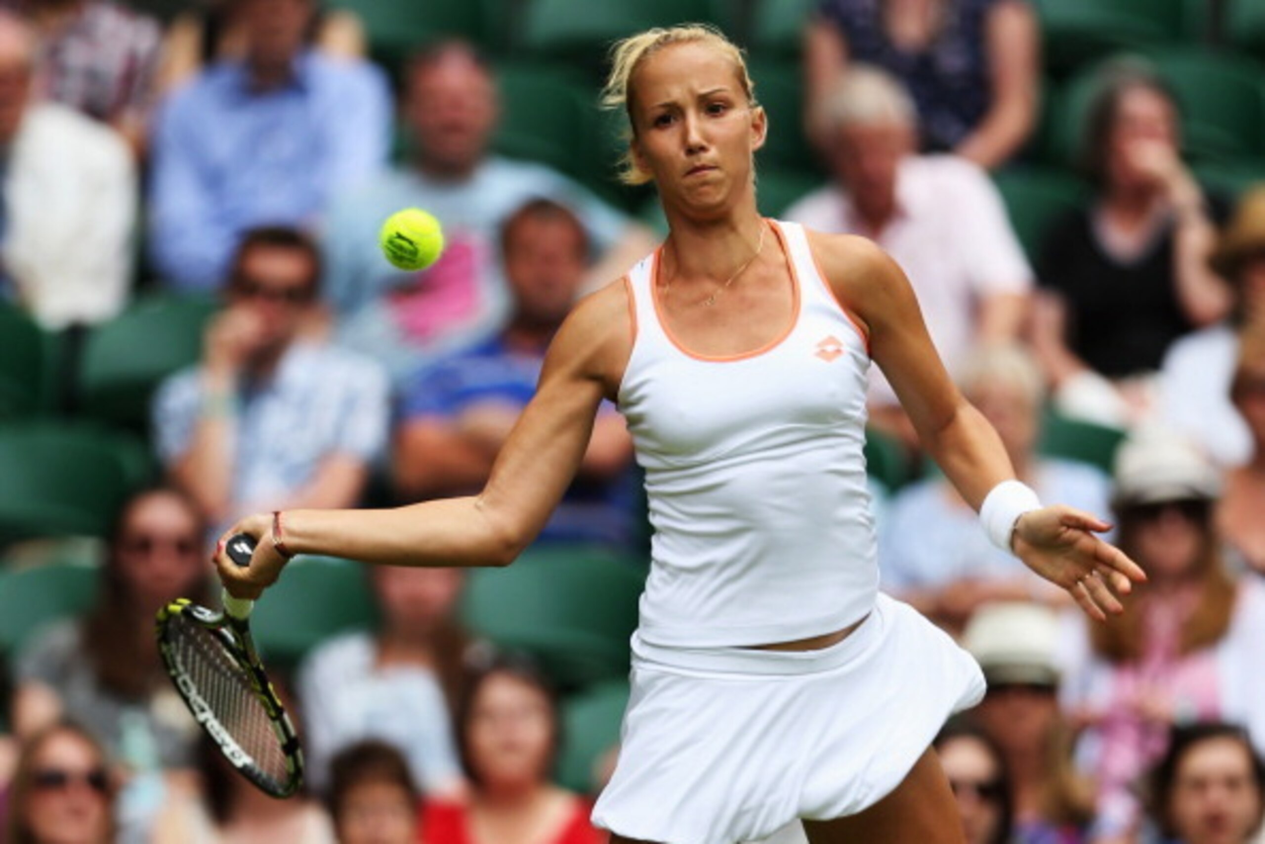 LONDON, ENGLAND - JUNE 23:  Paula Kania of Poland in action during her Ladies' Singles first round match against Na Li of China on day one of the Wimbledon Lawn Tennis Championships at the All England Lawn Tennis and Croquet Club at Wimbledon on June 23, 