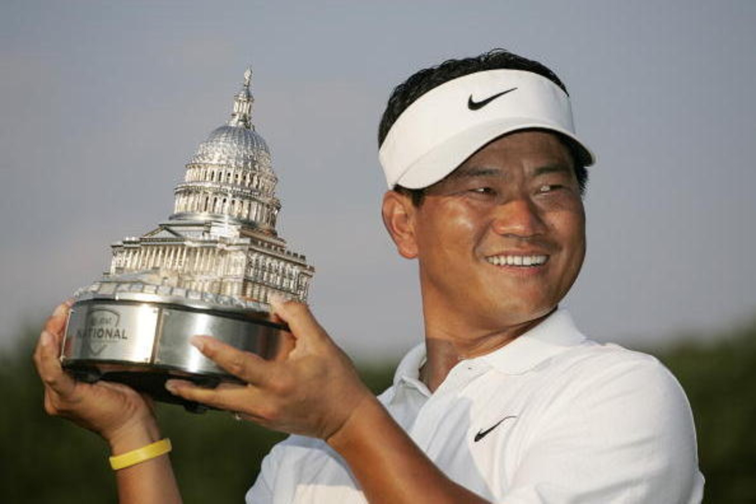 UNITED STATES - JULY 08:  K.J. Choi with the championship trophy after winning the AT&T National at Congressional Country Club on July 8, 2007 in Bethesda, Maryland.  (Photo by Hunter Martin/Getty Images)