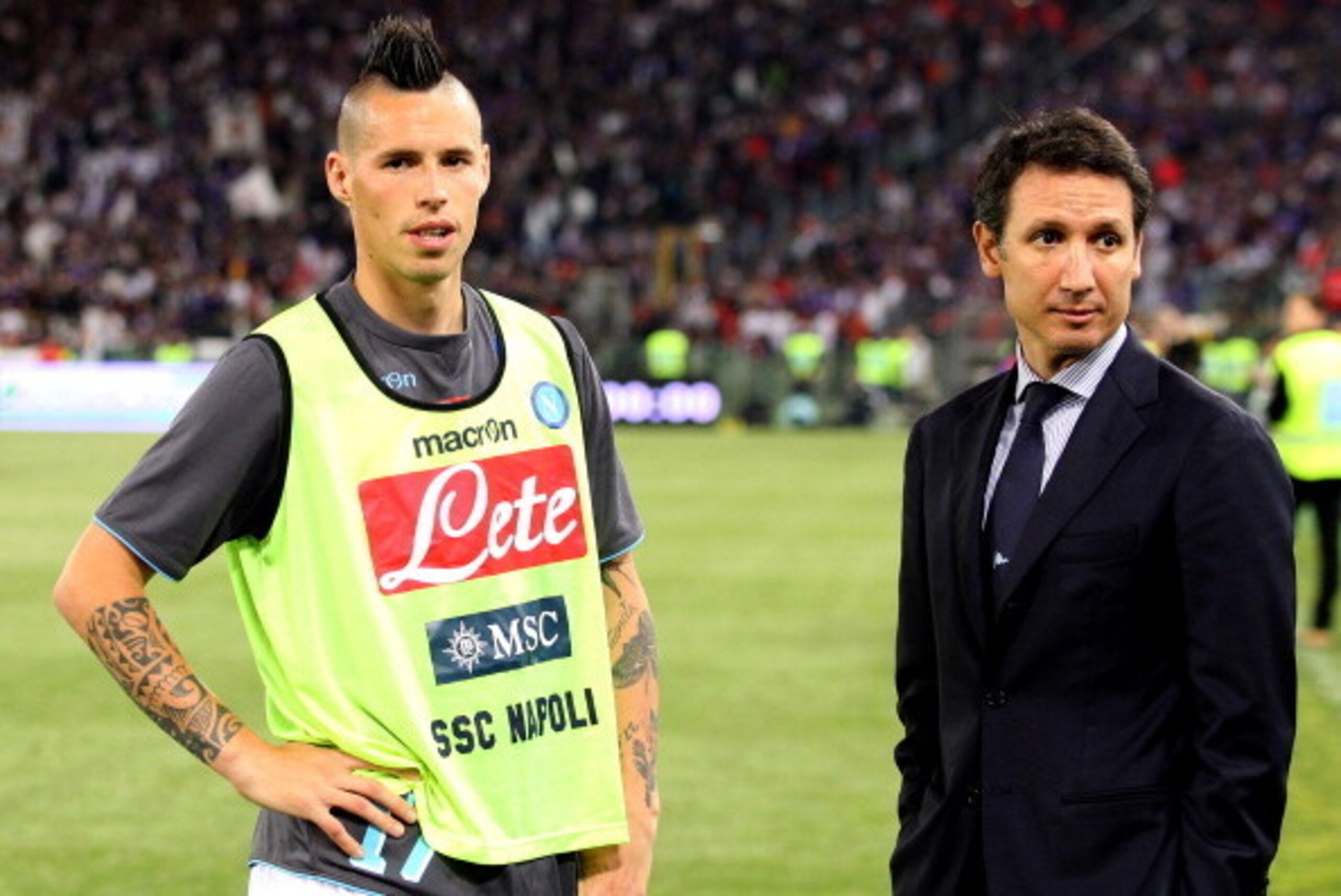 ROME, ITALY - MAY 03:  Marek Hamsik (L) and Team Manager Riccardo Bigon of SSC Napoli wait to speak with SSC Napoli fans before the TIM Cup final match between ACF Fiorentina and SSC Napoli at Olimpico Stadium on May 3, 2014 in Rome, Italy.  (Photo by Pao