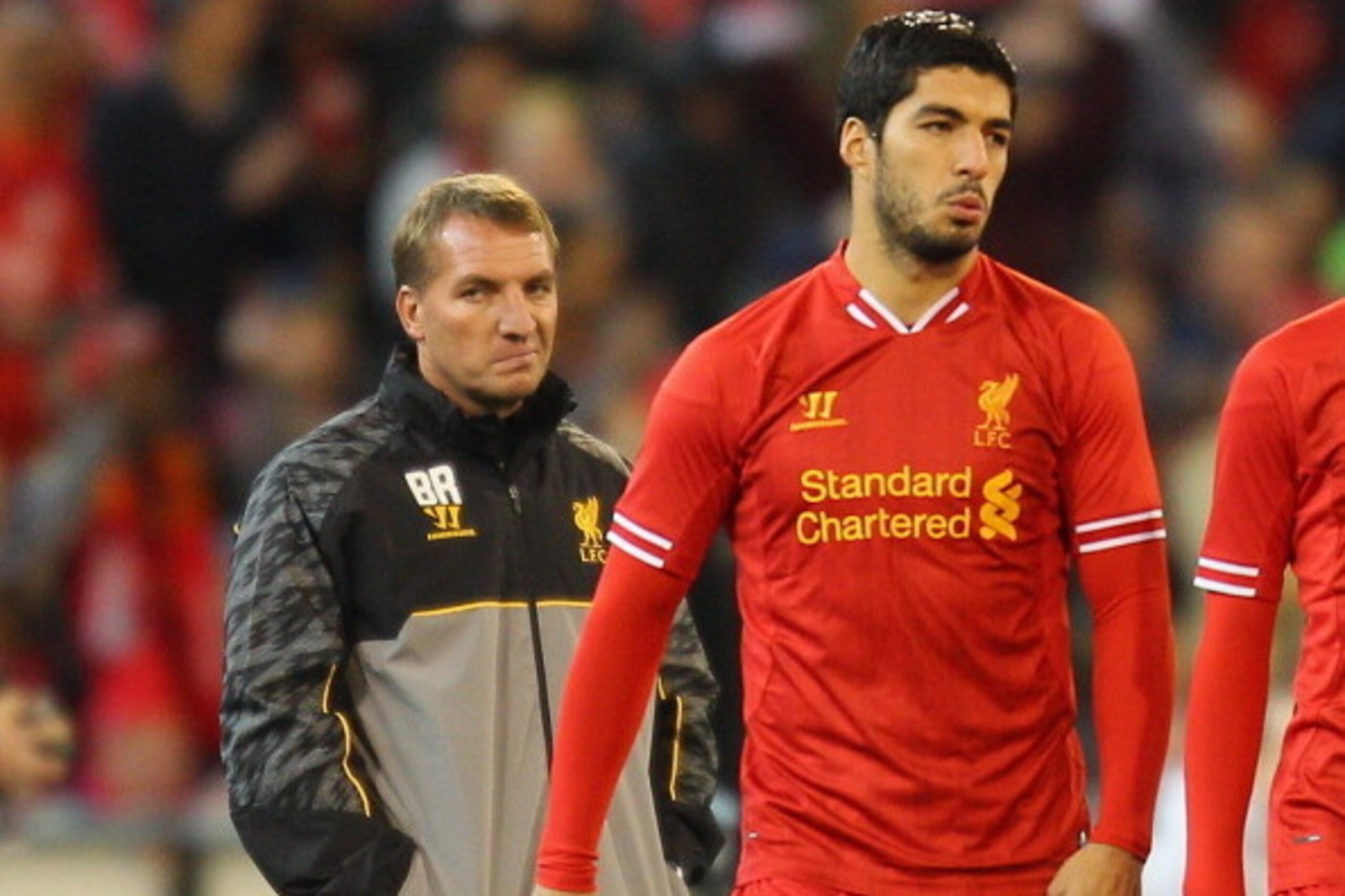 MELBOURNE, AUSTRALIA - JULY 24: Liverpool FC Manager Brendan Rodgers (L) looks on as Luis Suarez of Liverpool is substituted into the match during the match between the Melbourne Victory and Liverpool at the Melbourne Cricket Ground on July 24, 2013 in M MELBOURNE, AUSTRALIA - JULY 24: Liverpool FC Manager Brendan Rodgers (L) looks on as Luis Suarez of Liverpool is substituted into the match during the match between the Melbourne Victory and Liverpool at the Melbourne Cricket Ground on July 24, 2013 in M