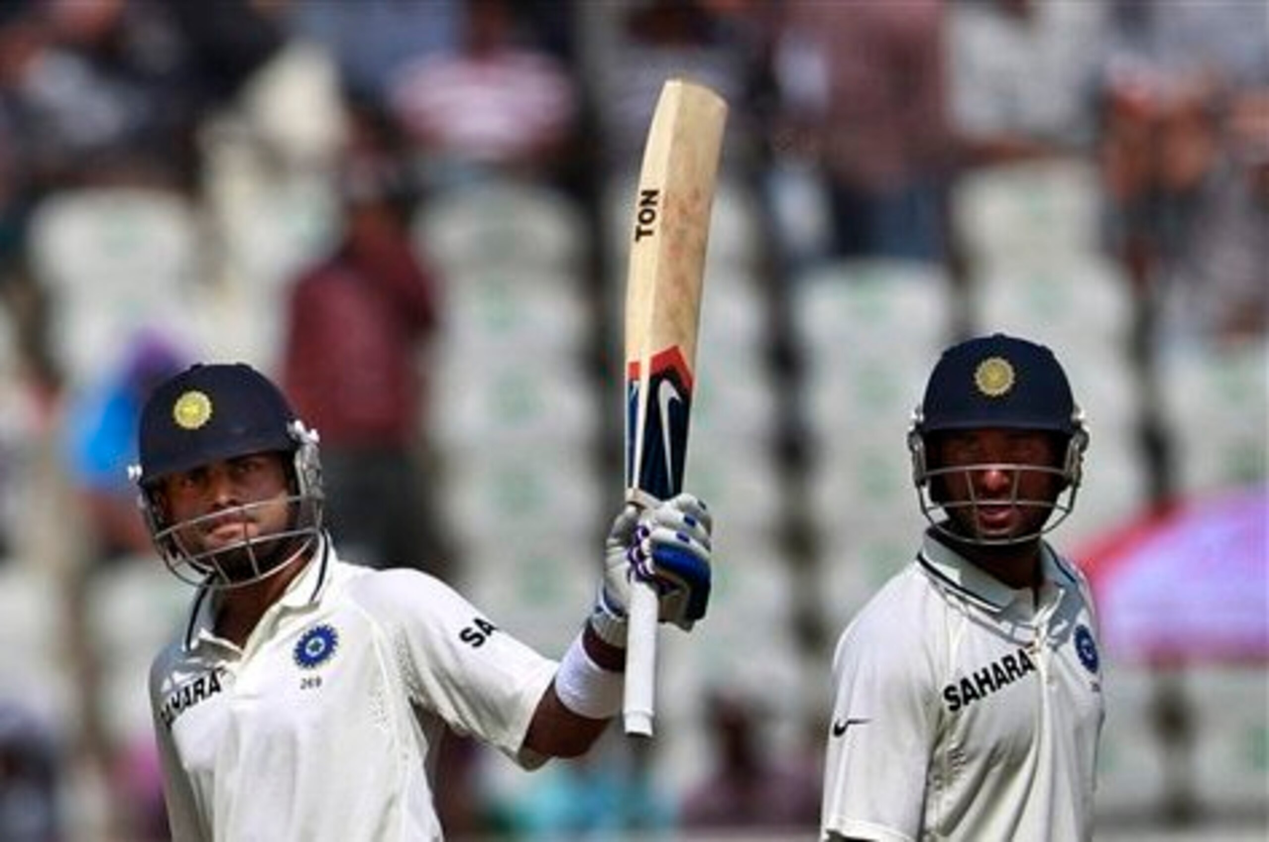 Virat Kohli (left) and Cheteshwar Pujara