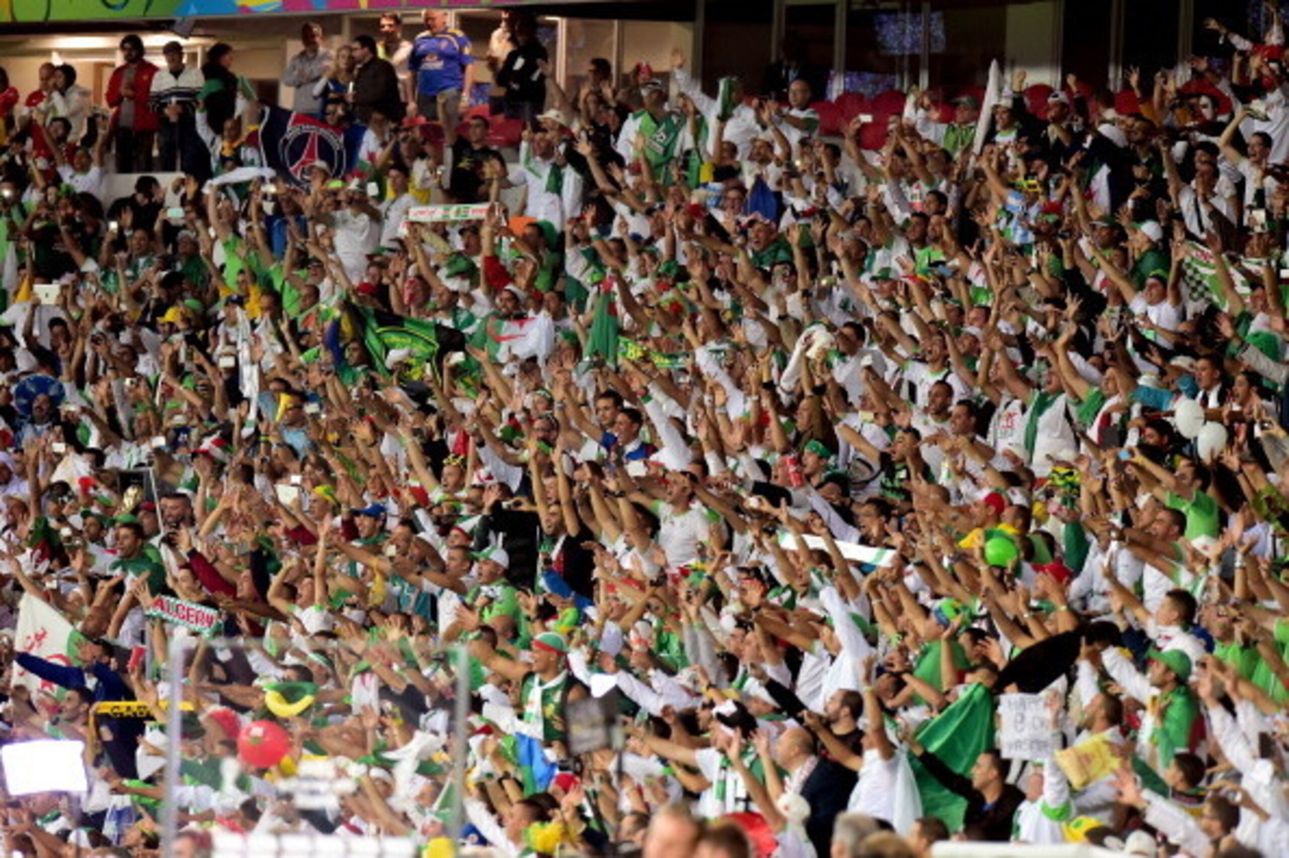 PORTO ALEGRE, BRAZIL - JUNE 22: Fans cheer during the 2014 FIFA World Cup Brazil Group H match between South Korea and Algeria at Estadio Beira-Rio on June 22, 2014 in Porto Alegre, Brazil.  (Photo by Vinicius Costa/Getty Images)