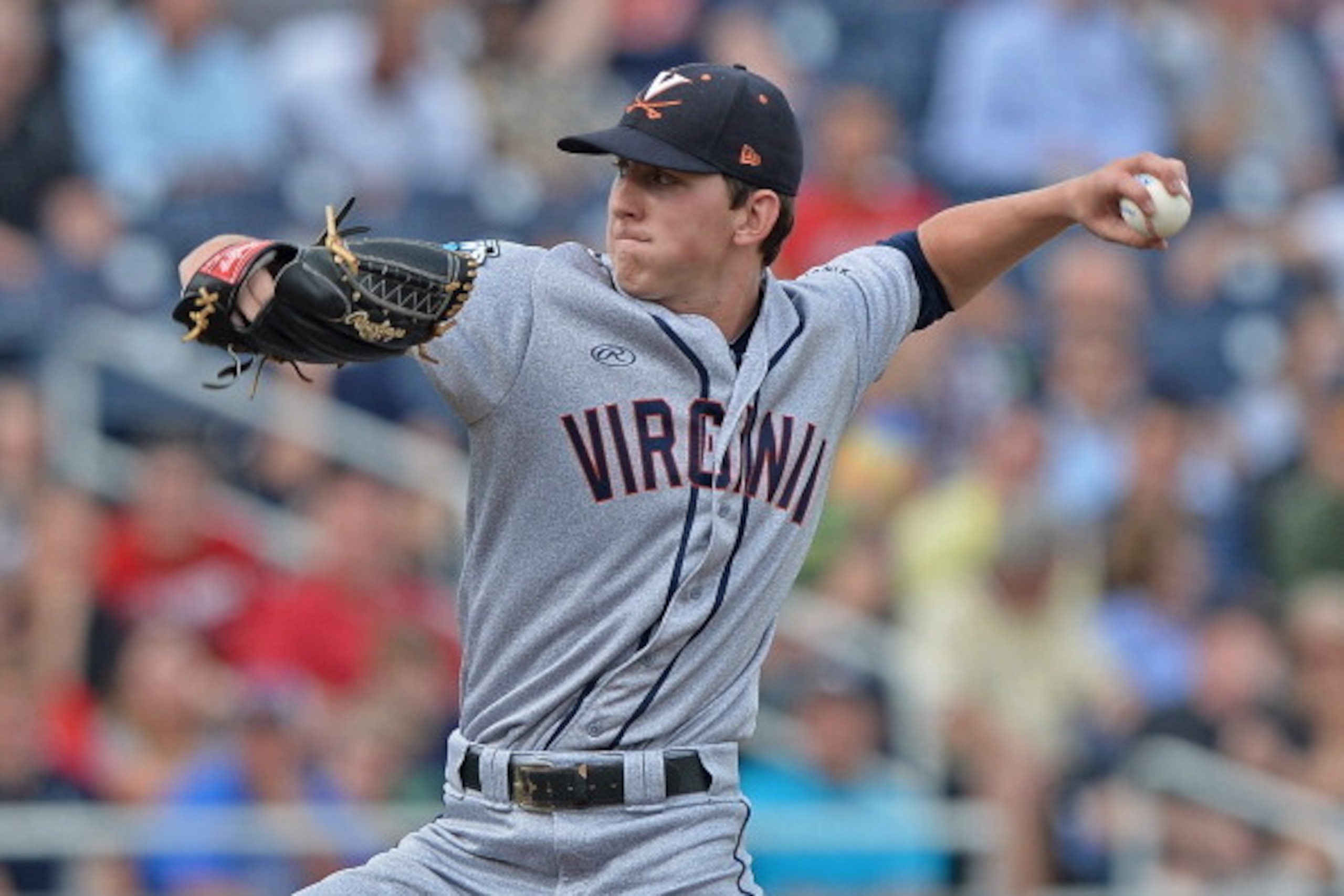 OMAHA, NE - JUNE 24:  Brandon Waddell #20 of the Virginia Cavaliers delivers a pitch against the Vanderbilt Commodores in the first inning during game two of the College World Series Championship Series on June 24, 2014 at TD Ameritrade Park in Omaha, Neb