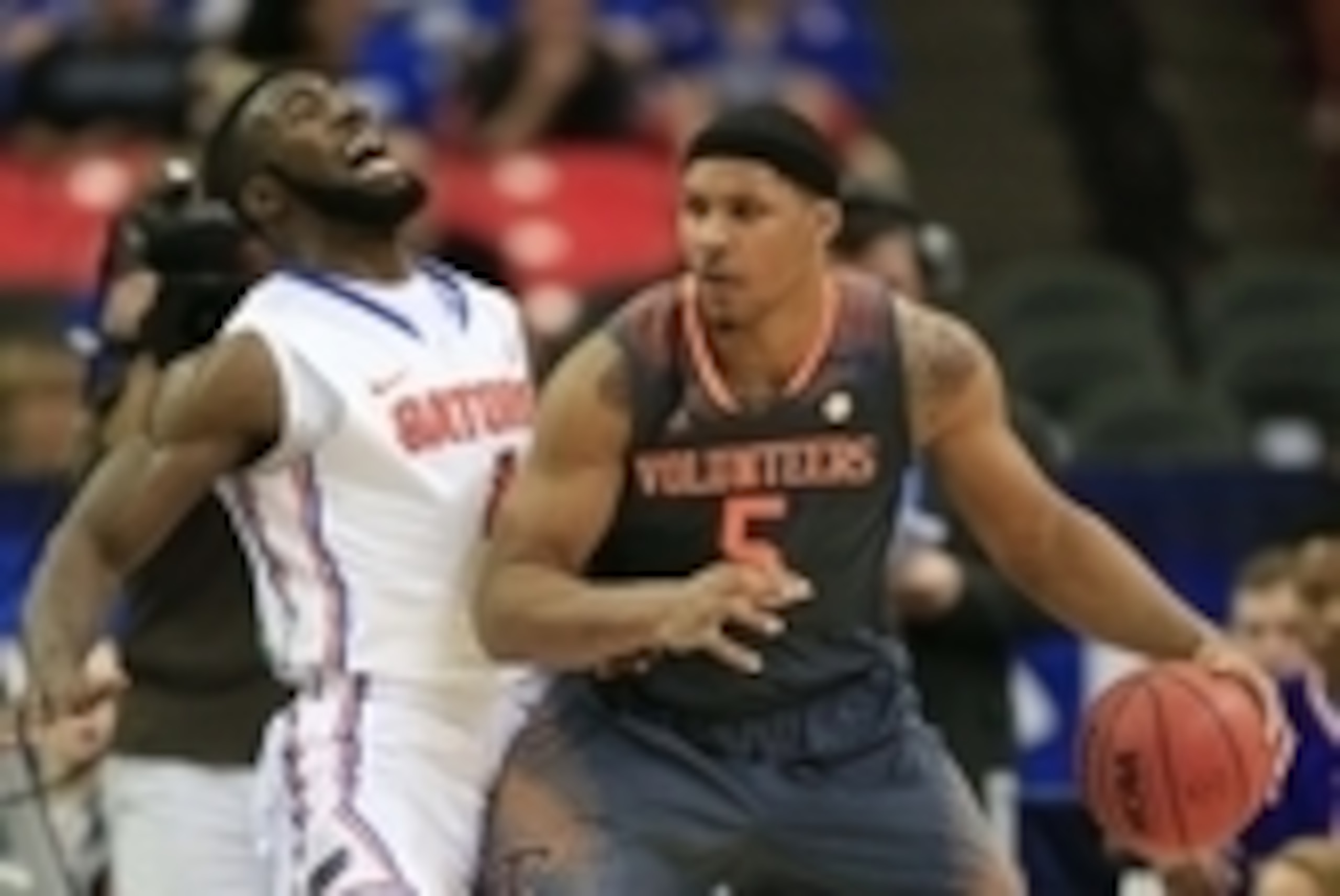 Mar 15, 2014; Atlanta, GA, USA; Tennessee Volunteers forward Jarnell Stokes (5) forks for position against Florida Gators center Patric Young (4) in the semifinals of the SEC college basketball tournament at Georgia Dome. Mandatory Credit: Paul Abell-USA 
