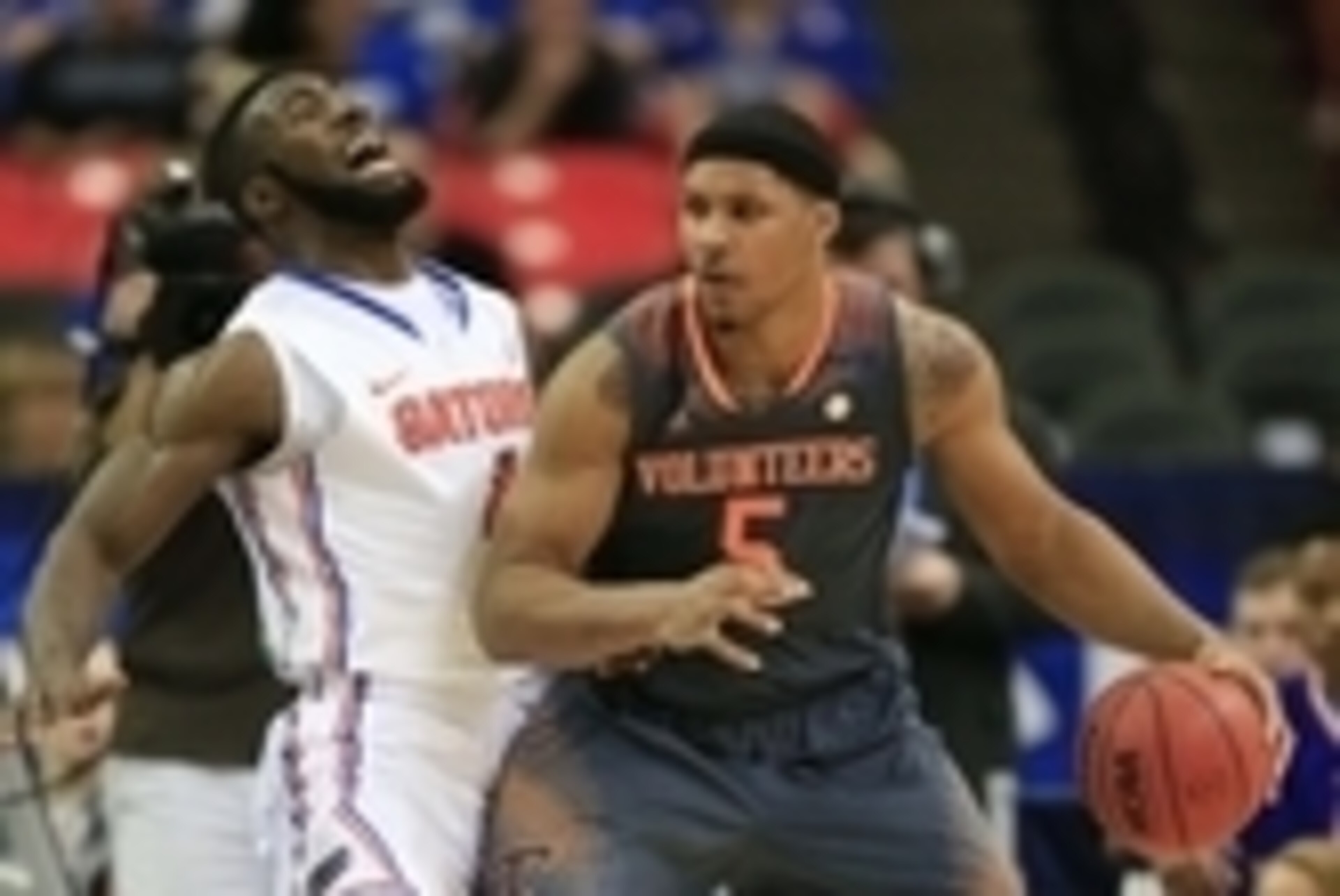 Mar 15, 2014; Atlanta, GA, USA; Tennessee Volunteers forward Jarnell Stokes (5) forks for position against Florida Gators center Patric Young (4) in the semifinals of the SEC college basketball tournament at Georgia Dome. Mandatory Credit: Paul Abell-USA 