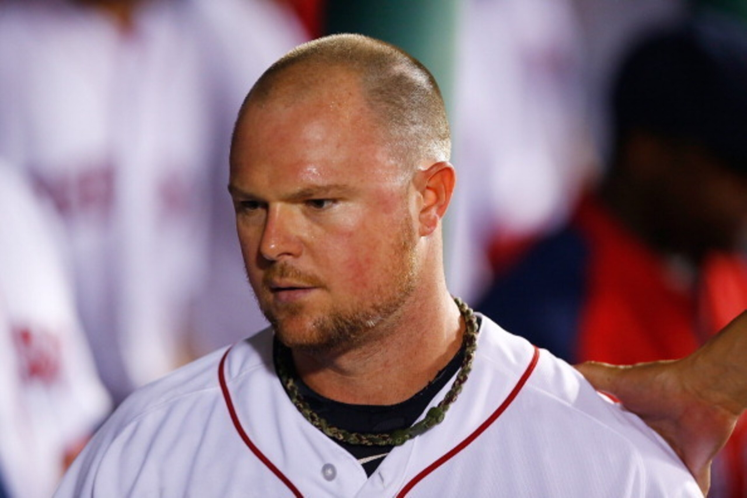 BOSTON, MA - JUNE 17:  Jon Lester #31 of the Boston Red Sox is congratulated by teammates in the dugout after being pulled from the game in the seventh inning against the Minnesota Twins during the game at Fenway Park on June 17, 2014 in Boston, Massachus