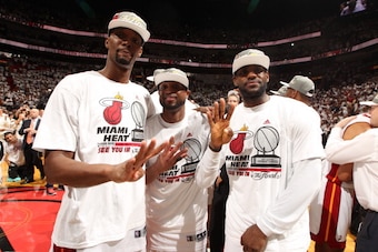 MIAMI, FL - MAY 30: Chris Bosh #1, Dwyane Wade #3, and LeBron James #6 of the Miami Heat celebrate after Game Six of the Eastern Conference Finals against the Indiana Pacers during the 2014 NBA Playoffs on May 30, 2014 in Miami, Fl. NOTE TO USER: User exp
