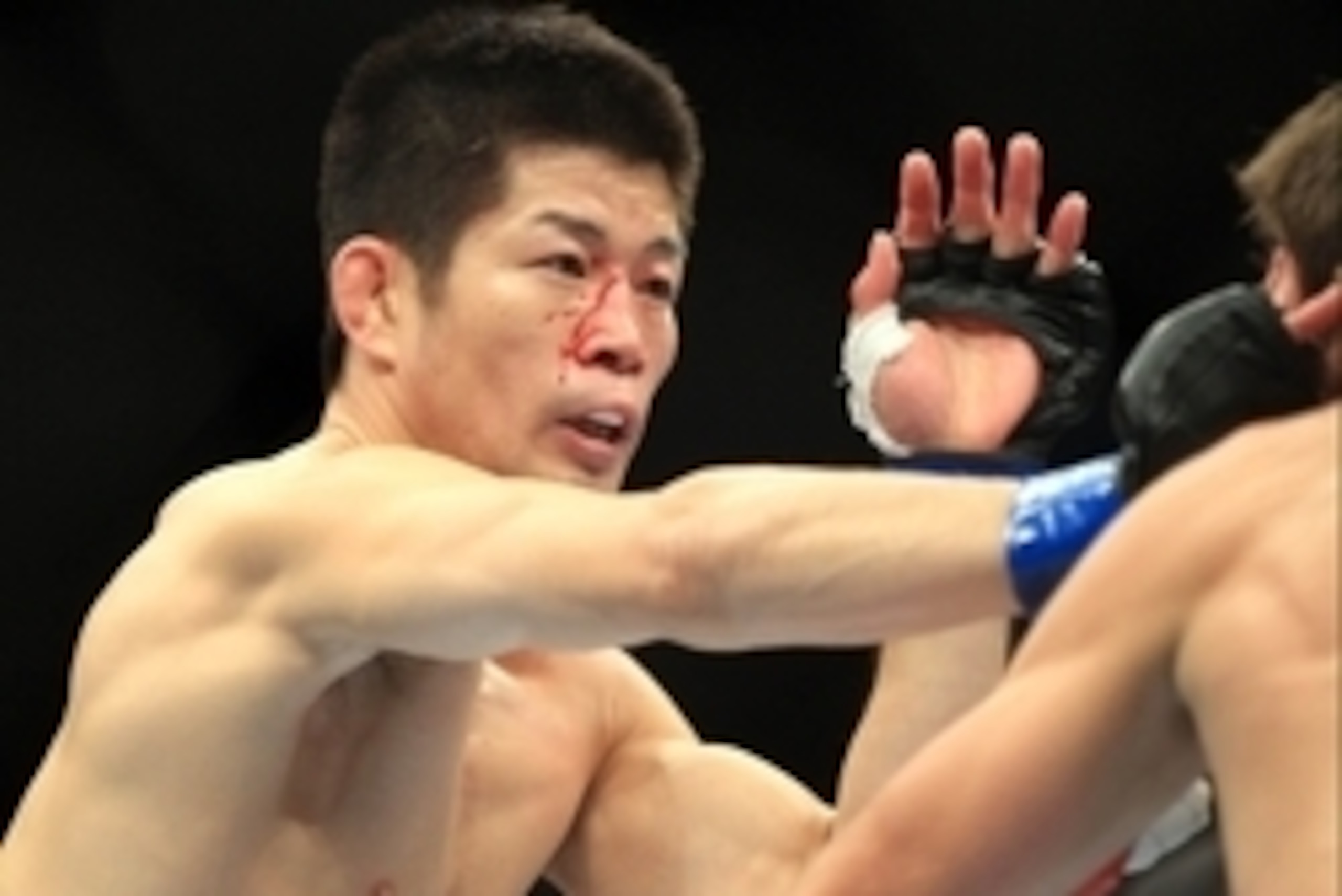 Aug 27, 2013; Indianapolis, IN, USA; Darren Elkins (red gloves) fights Hatsu Hioki (blue gloves) during UFC Fight Night 27 at Bankers Life Fieldhouse. Mandatory Credit: Pat Lovell-USA TODAY Sports