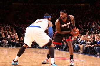NEW YORK, NY - JANUARY 9: LeBron James #6 of the Miami Heat controls the ball against Carmelo Anthony #7 of the New York Knicks during a game at Madison Square Garden in New York City on January 9, 2014.  NOTE TO USER: User expressly acknowledges and agre
