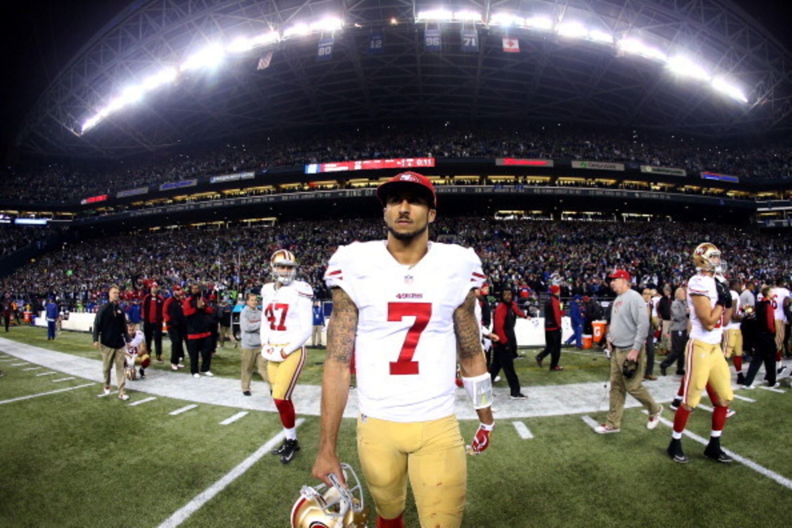 SEATTLE, WA - JANUARY 19:  Quarterback Colin Kaepernick #7 of the San Francisco 49ers walks off the field after losing to the Seattle Seahawks 23-17 during the 2014 NFC Championship at CenturyLink Field on January 19, 2014 in Seattle, Washington.  (Photo 