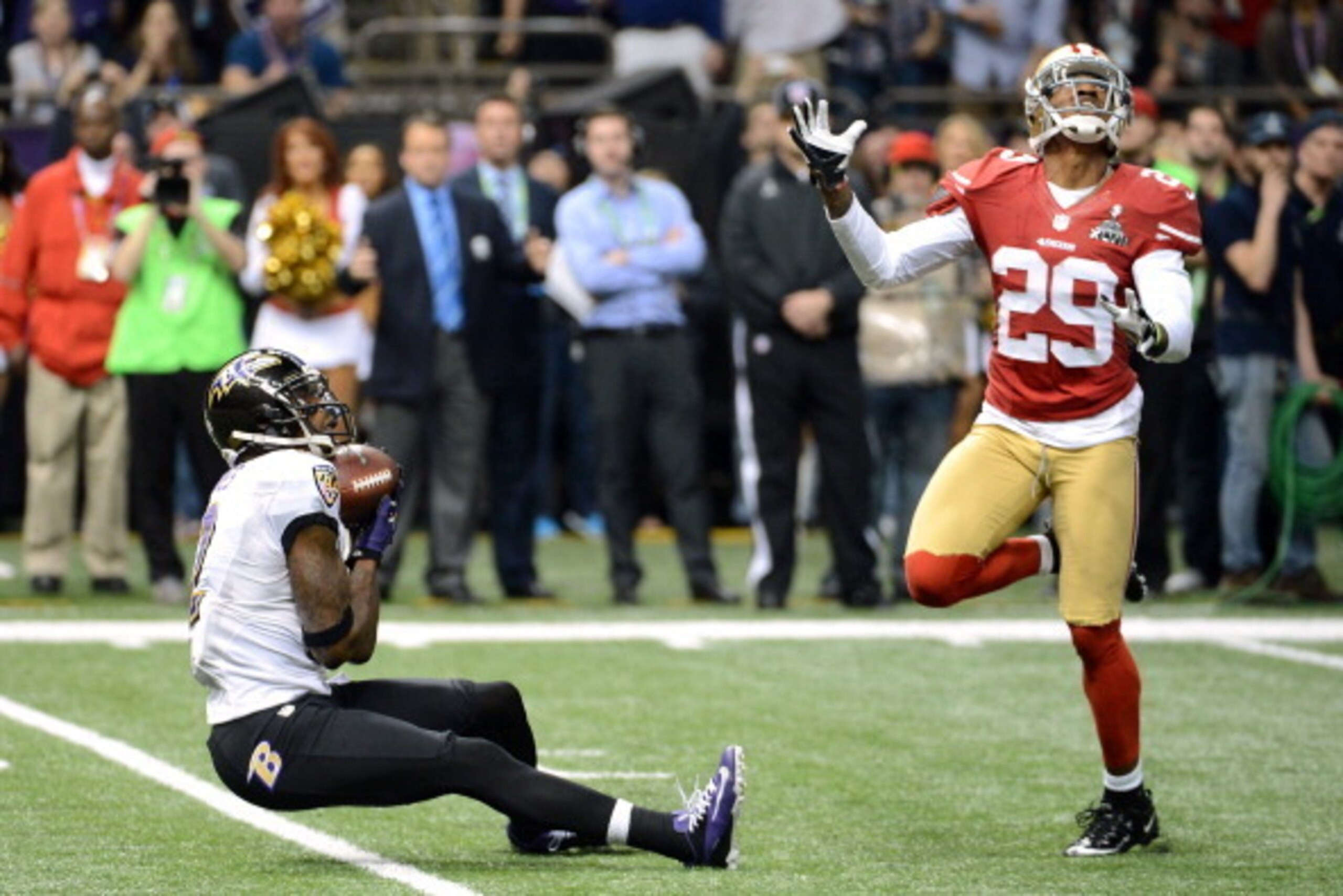 NEW ORLEANS, LA - FEBRUARY 03:  Torrey Smith #82 of the Baltimore Ravens catches a 56-yard touchdown reception against Chris Culliver #29 of the San Francisco 49ers during Super Bowl XLVII at the Mercedes-Benz Superdome on February 3, 2013 in New Orleans,