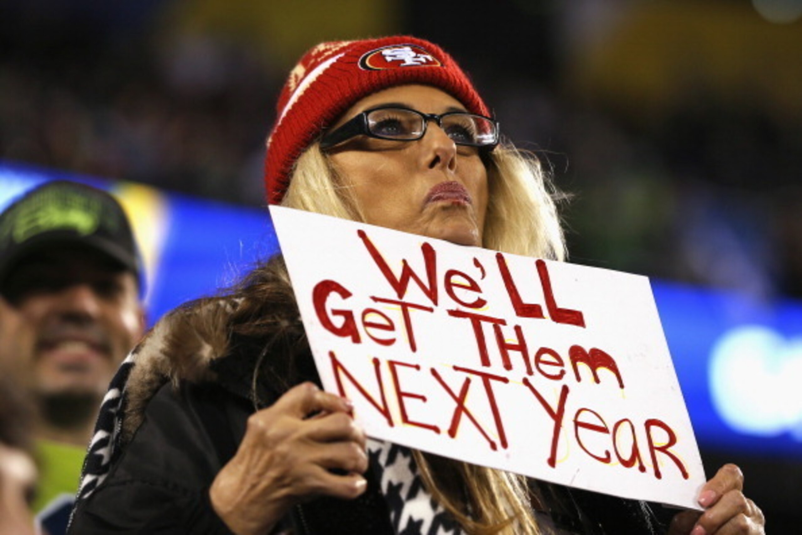 EAST RUTHERFORD, NJ - FEBRUARY 02: A fan wearing a San Francisco 49ers hat holds up a sign that reads 'We'll Get Them Next Year' as the Seattle Seahawks take on the Denver Broncos during Super Bowl XLVIII at MetLife Stadium on February 2, 2014 in East Rut