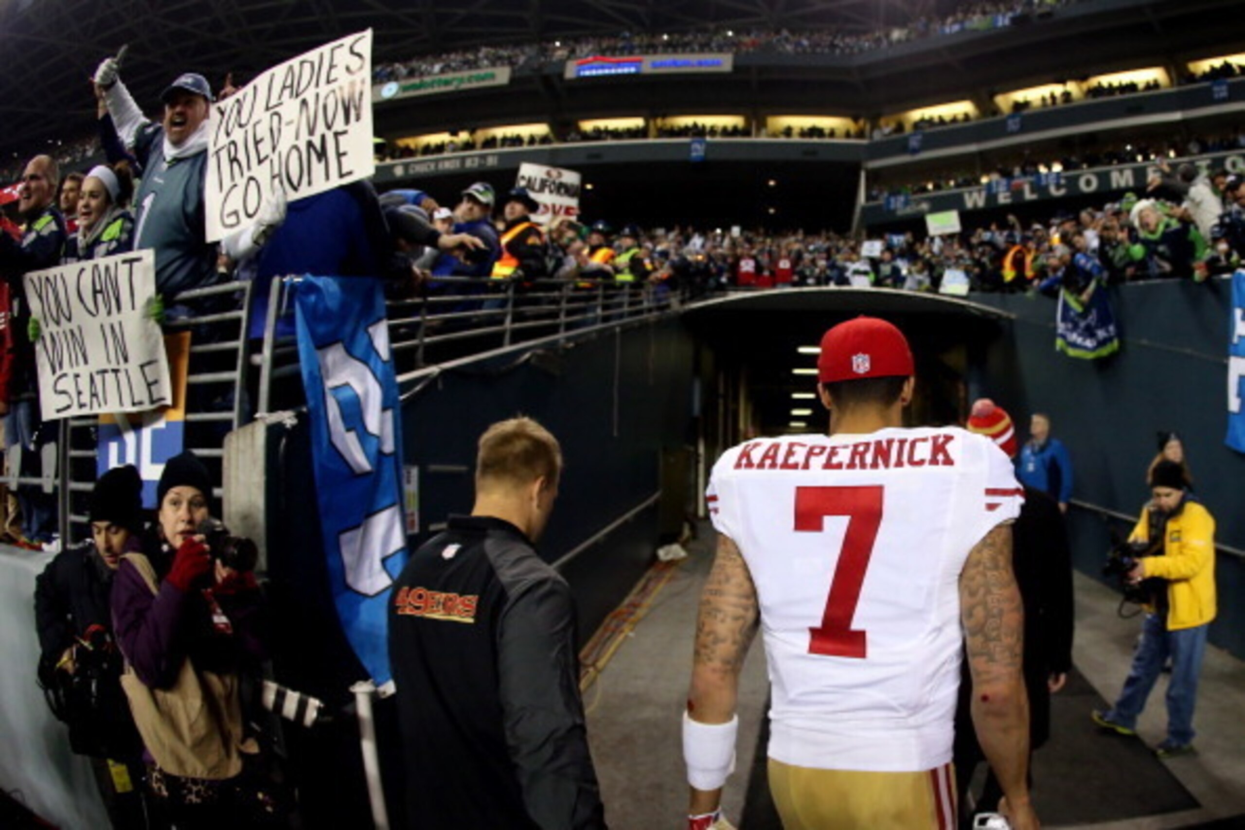SEATTLE, WA - JANUARY 19:  Quarterback Colin Kaepernick #7 of the San Francisco 49ers walks off the field after losing to the Seattle Seahawks 23-17 in the 2014 NFC Championship at CenturyLink Field on January 19, 2014 in Seattle, Washington.  (Photo by C