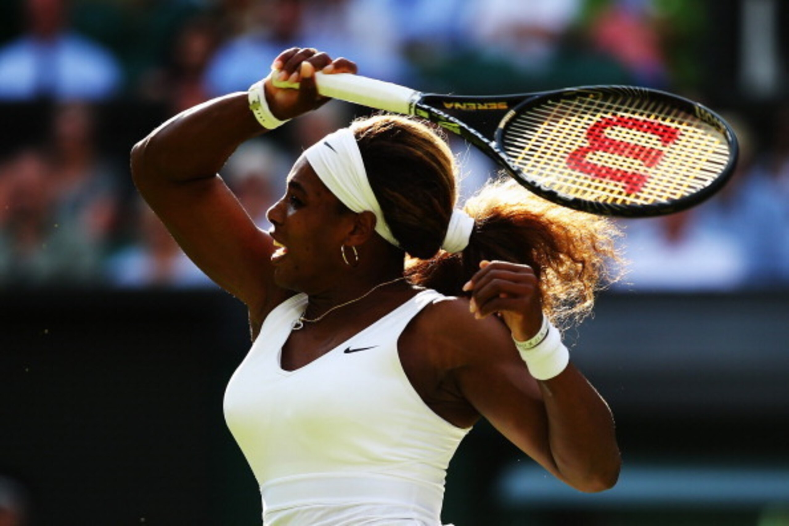 LONDON, ENGLAND - JUNE 24:  Serena Williams of the United States in action during her Ladies' Singles first round match against Anna Tatishvili of the United States on day two of the Wimbledon Lawn Tennis Championships at the All England Lawn Tennis and C