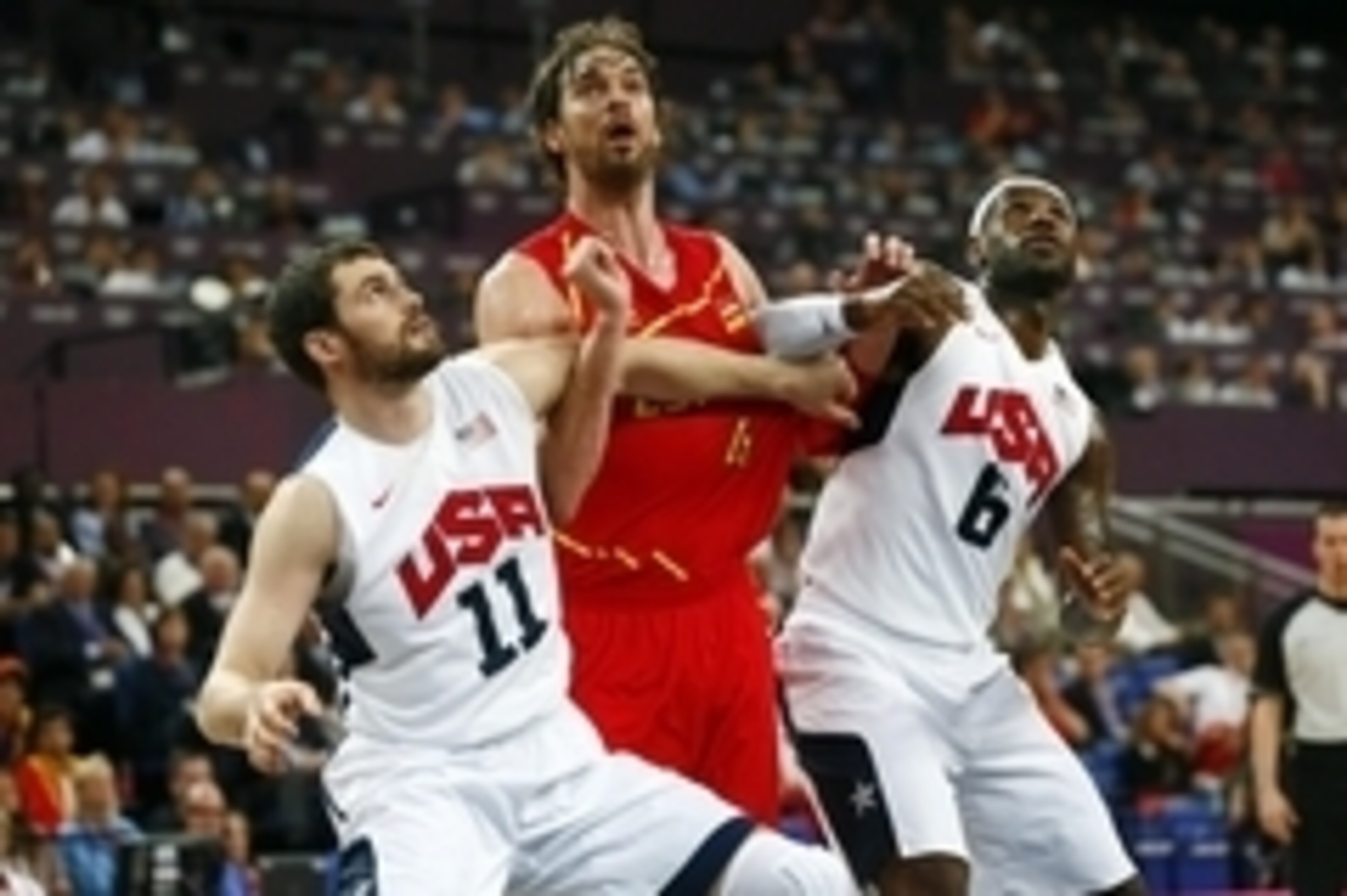 Aug 12, 2012; London, United Kingdom; Spain forward Pau Gasol (middle) is boxed out between USA forwards Kevin Love (11) and LeBron James (6) during the men's basketball gold medal game in the London 2012 Olympic Games at North Greenwich Arena. Mandatory 
