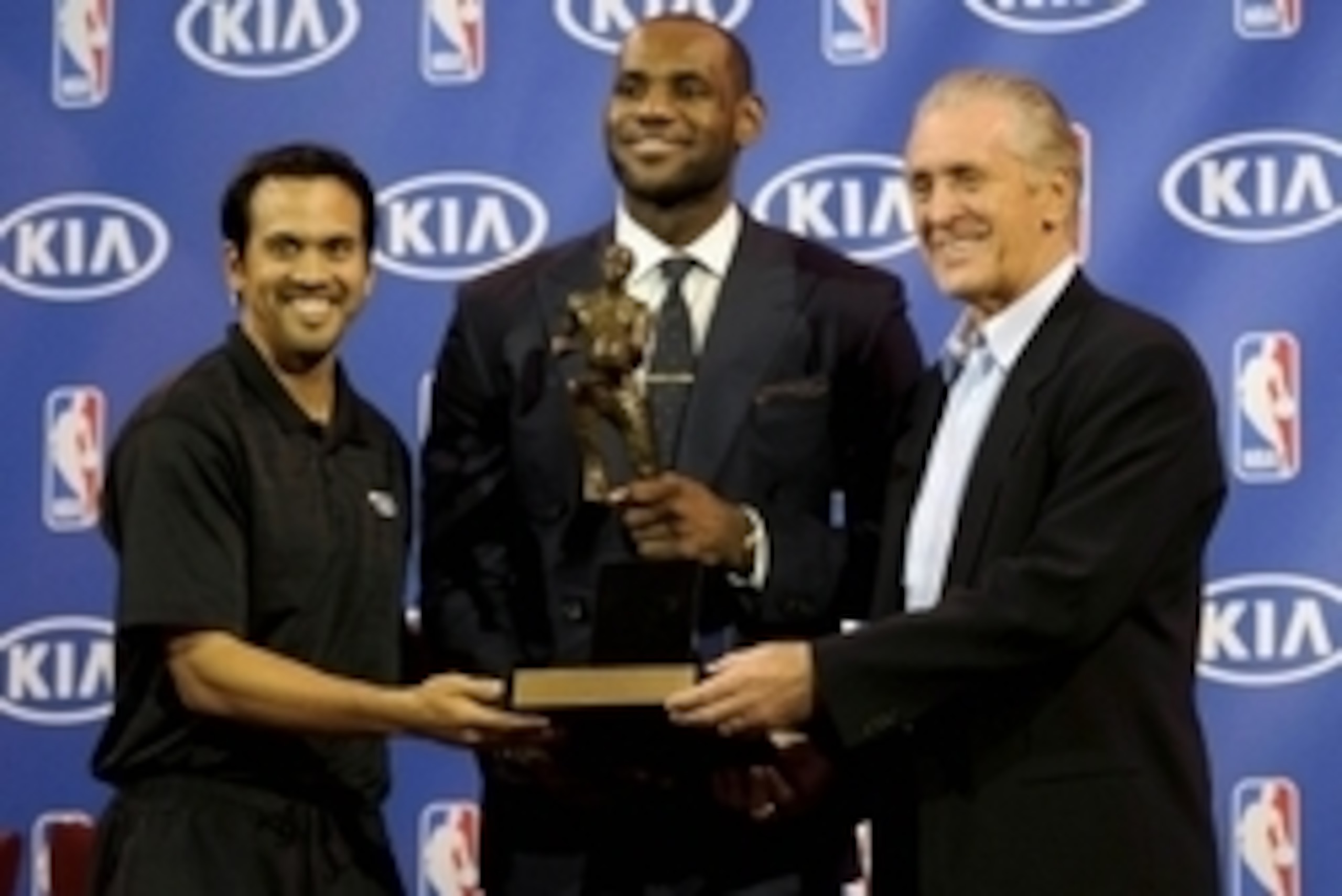 May 5, 2013; Miami, FL, USA; Miami Heat small forward LeBron James (center) holds his fourth MVP trophy next to head coach Erik Spoelstra (left) and Heat president Pat Riley (right) at the American Airlines Arena. Mandatory Credit: Steve Mitchell-USA TODA