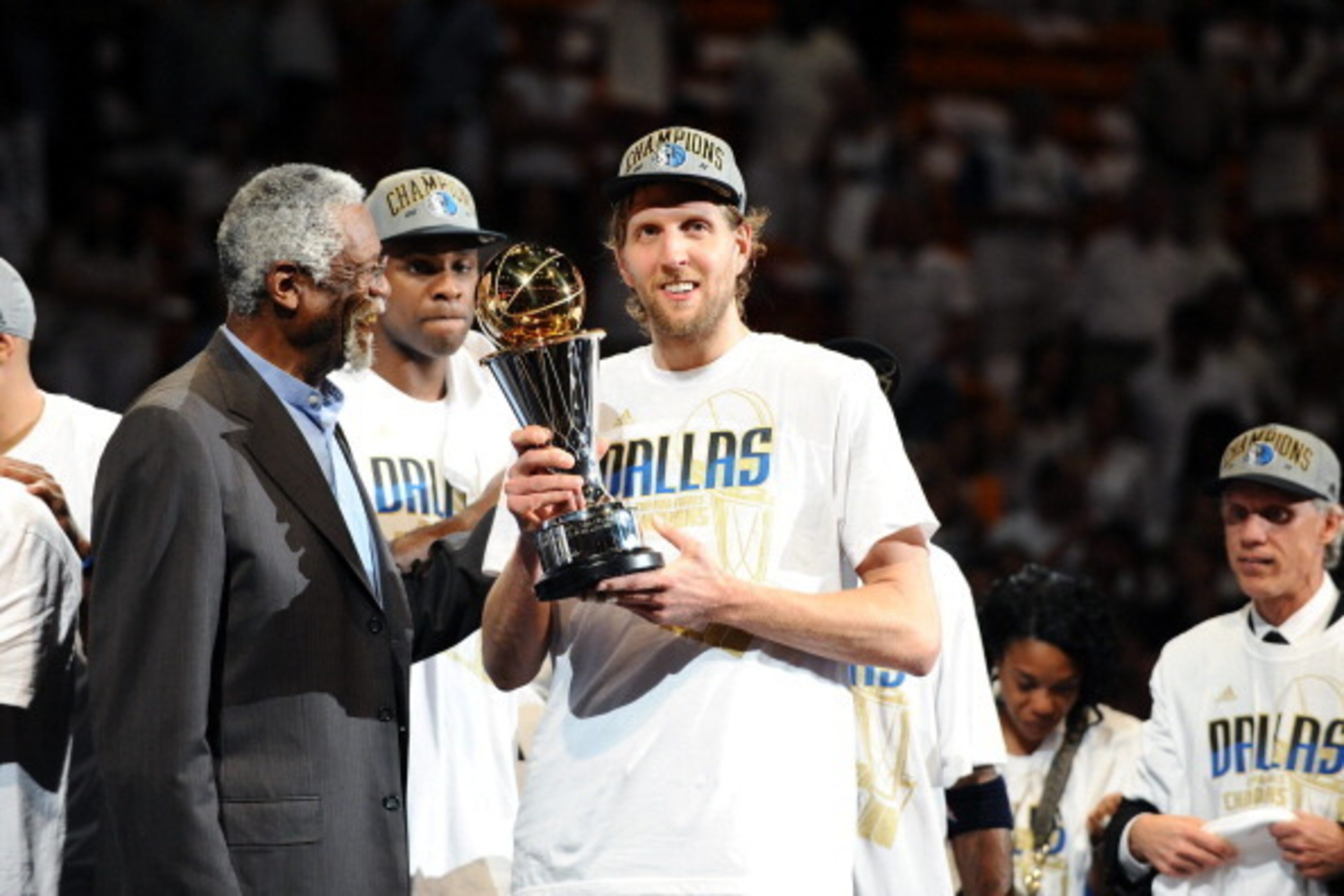 MIAMI, FL - JUNE 12:  Dirk Nowitzki #41 of the Dallas Mavericks holds up the Bill Russell Finals MVP trophy after Bill Russell presented it to him after deafeating the Miami Heat in Game Six of the 2011 NBA Finals on June 12, 2011 at the American Airlines