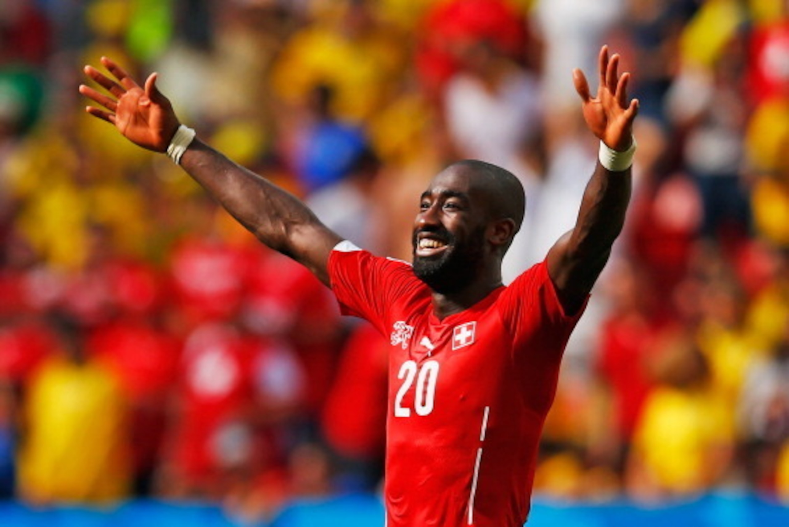 BRASILIA, BRAZIL - JUNE 15:  Johan Djourou of Switzerland celebrates after defeating Ecuador 2-1 during the 2014 FIFA World Cup Brazil Group E match between Switzerland and Ecuador at Estadio Nacional on June 15, 2014 in Brasilia, Brazil.  (Photo by Matth