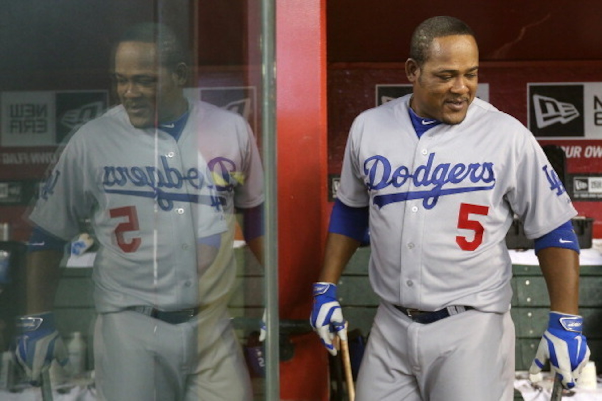 PHOENIX, AZ - APRIL 13:  Juan Uribe #5 of the Los Angeles Dodgers in the dugout before the MLB game against the Arizona Diamondbacks at Chase Field on April 13, 2014 in Phoenix, Arizona. The Dodgers defeated the Diamondbacks 8-6. (Photo by Christian Peter