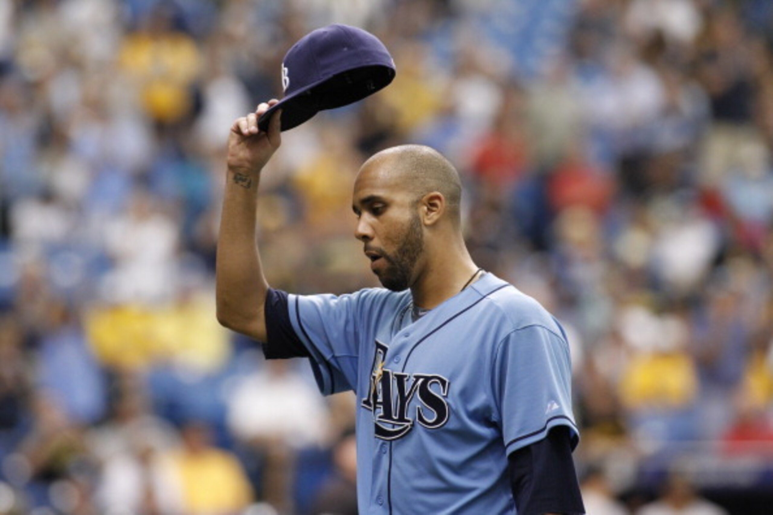 ST. PETERSBURG, FL - JUNE 25:  Pitcher David Price #14 of the Tampa Bay Rays lifts his hat to the crowd as he comes off the mound after giving up a solo home run to Andrew McCutchen #22 of the Pittsburgh Pirates during the ninth inning of a game on June 2