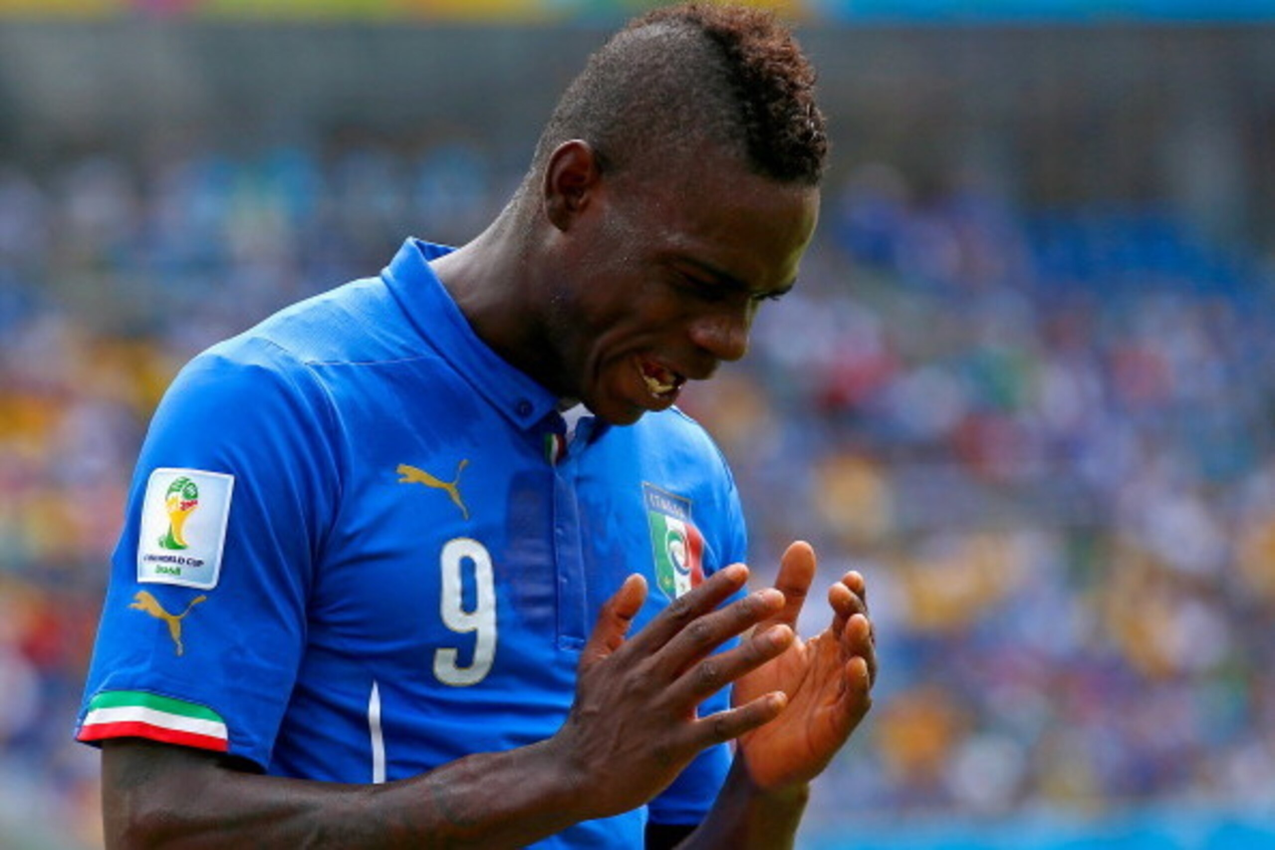 NATAL, BRAZIL - JUNE 24:  Mario Balotelli of Italy reacts during the 2014 FIFA World Cup Brazil Group D match between Italy and Uruguay at Estadio das Dunas on June 24, 2014 in Natal, Brazil.  (Photo by Clive Rose/Getty Images)