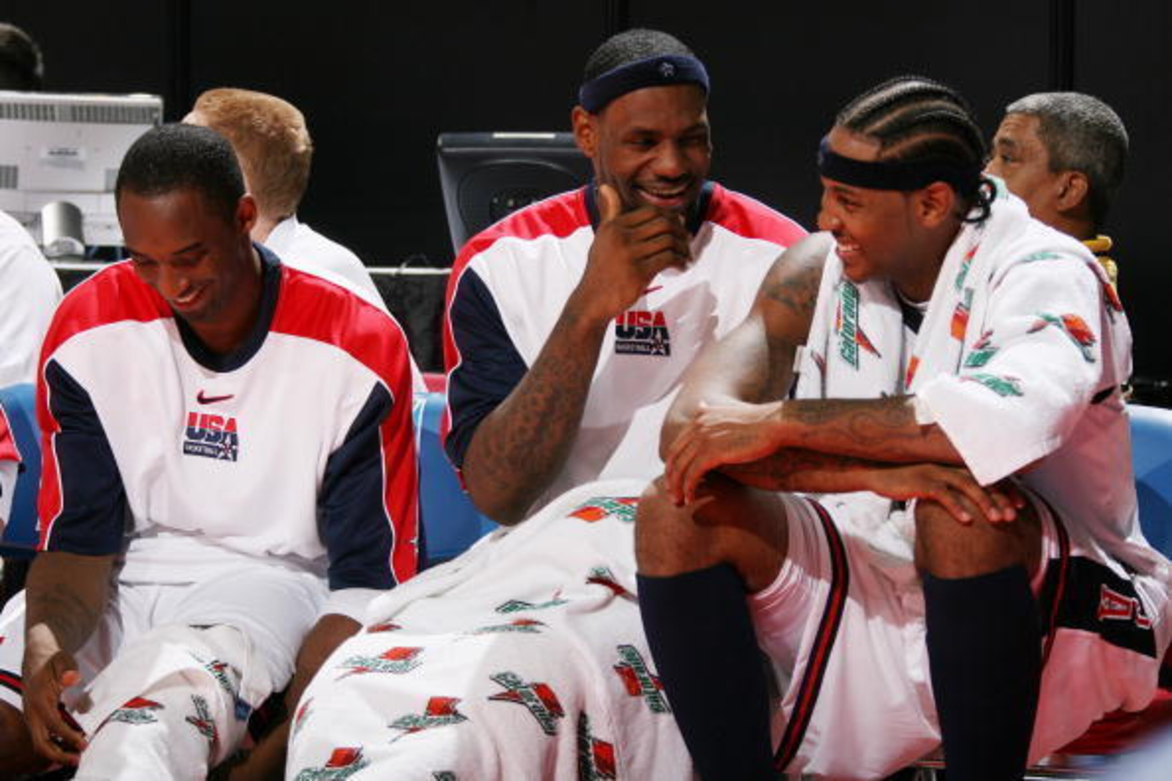 LAS VEGAS - AUGUST 22: Kobe Bryant #10, LeBron James #6 and Carmelo Anthony #15 of the USA Men's Senior National Team laugh on the bench against Venezuela during the first round of the 2007 FIBA Americas Championship on August 22, 2007 at the Thomas and M