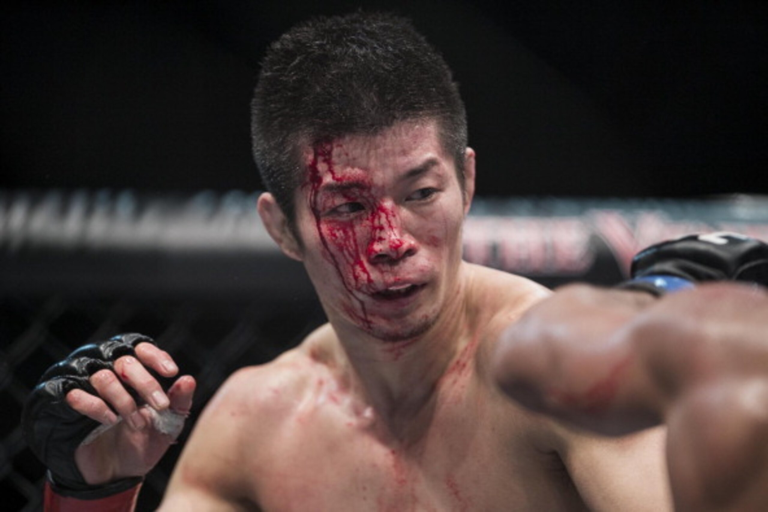 MACAU - MARCH 01:  Hatsu Hioki (L) of Japan fights againts Ivan Menjivar of Canada in their lightweight bout during the UFC Fight Night at the Cotai Arena on March 1, 2014 in Macau, China.  (Photo by Victor Fraile/Getty Images)