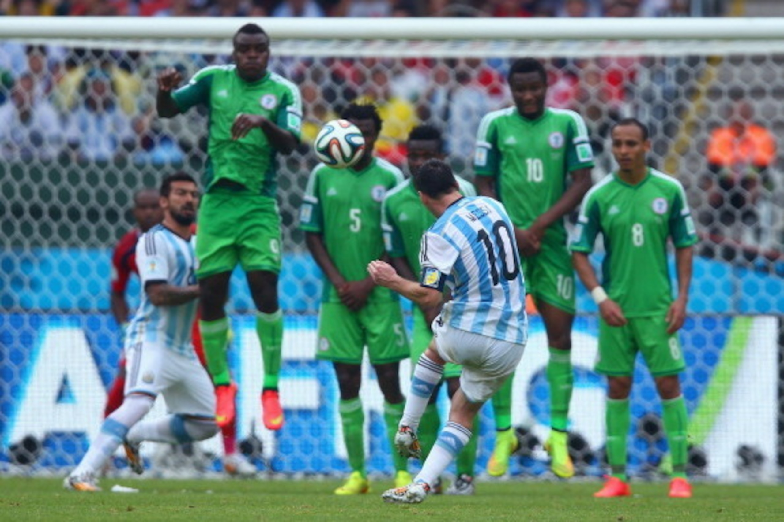PORTO ALEGRE, BRAZIL - JUNE 25: Lionel Messi of Argentina scores his team's second goal and his second of the game during the 2014 FIFA World Cup Brazil Group F match between Nigeria and Argentina at Estadio Beira-Rio on June 25, 2014 in Porto Alegre, Bra
