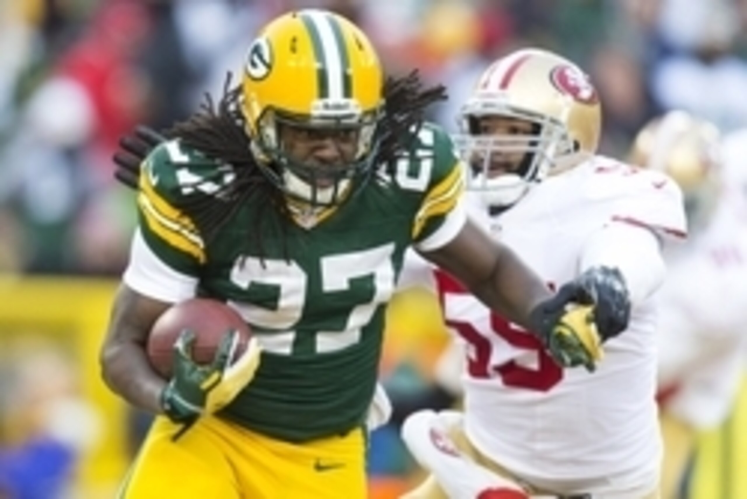 Jan 5, 2014; Green Bay, WI, USA; Green Bay Packers running back Eddie Lacy (27) carries the ball during the first quarter against the San Francisco 49ers during the 2013 NFC wild card playoff football game at Lambeau Field. Mandatory Credit: Jeff Hanisch-