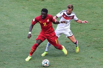 FORTALEZA, BRAZIL - JUNE 21:  Sulley Muntari of Ghana and Mario Goetze of Germany compete for the ball during the 2014 FIFA World Cup Brazil Group G match between Germany and Ghana at Castelao on June 21, 2014 in Fortaleza, Brazil.  (Photo by Jamie McDona