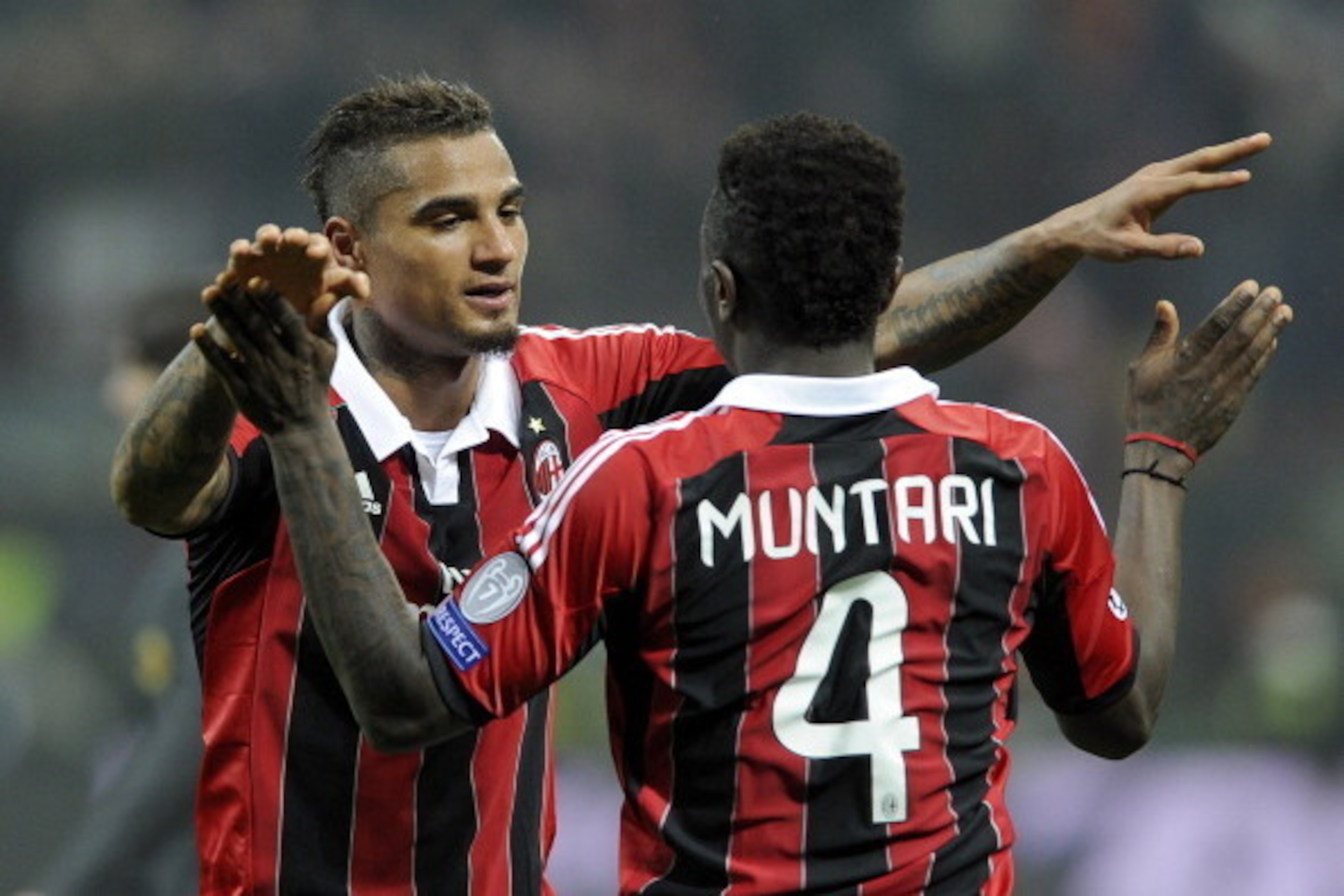 MILAN, ITALY - FEBRUARY 20: Kevin Prince Boateng and Sulley Muntari of AC Milan celebrate victory at the end of the UEFA Champions League Round of 16 first leg match between AC Milan and Barcelona at San Siro Stadium on February 20, 2013 in Milan, Italy. MILAN, ITALY - FEBRUARY 20: Kevin Prince Boateng and Sulley Muntari of AC Milan celebrate victory at the end of the UEFA Champions League Round of 16 first leg match between AC Milan and Barcelona at San Siro Stadium on February 20, 2013 in Milan, Italy.
