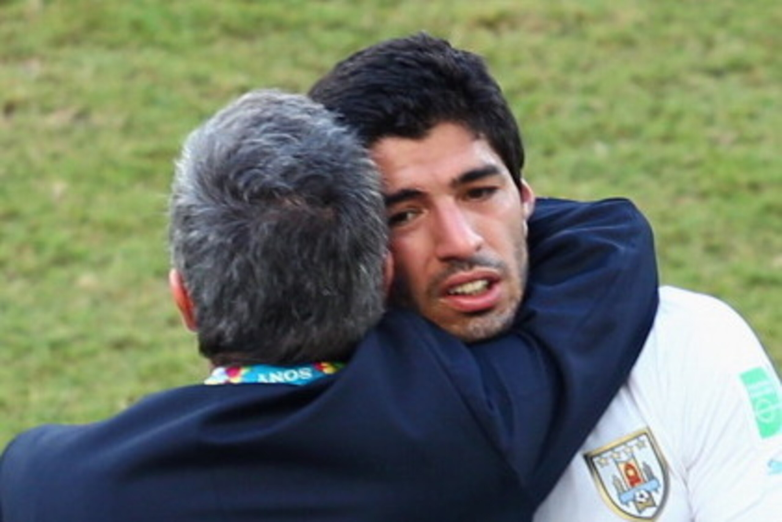 NATAL, BRAZIL - JUNE 24:  Head coach Oscar Tabarez of Uruguay hugs Luis Suarez after a 1-0 victory over Italy during the 2014 FIFA World Cup Brazil Group D match between Italy and Uruguay at Estadio das Dunas on June 24, 2014 in Natal, Brazil.  (Photo by 