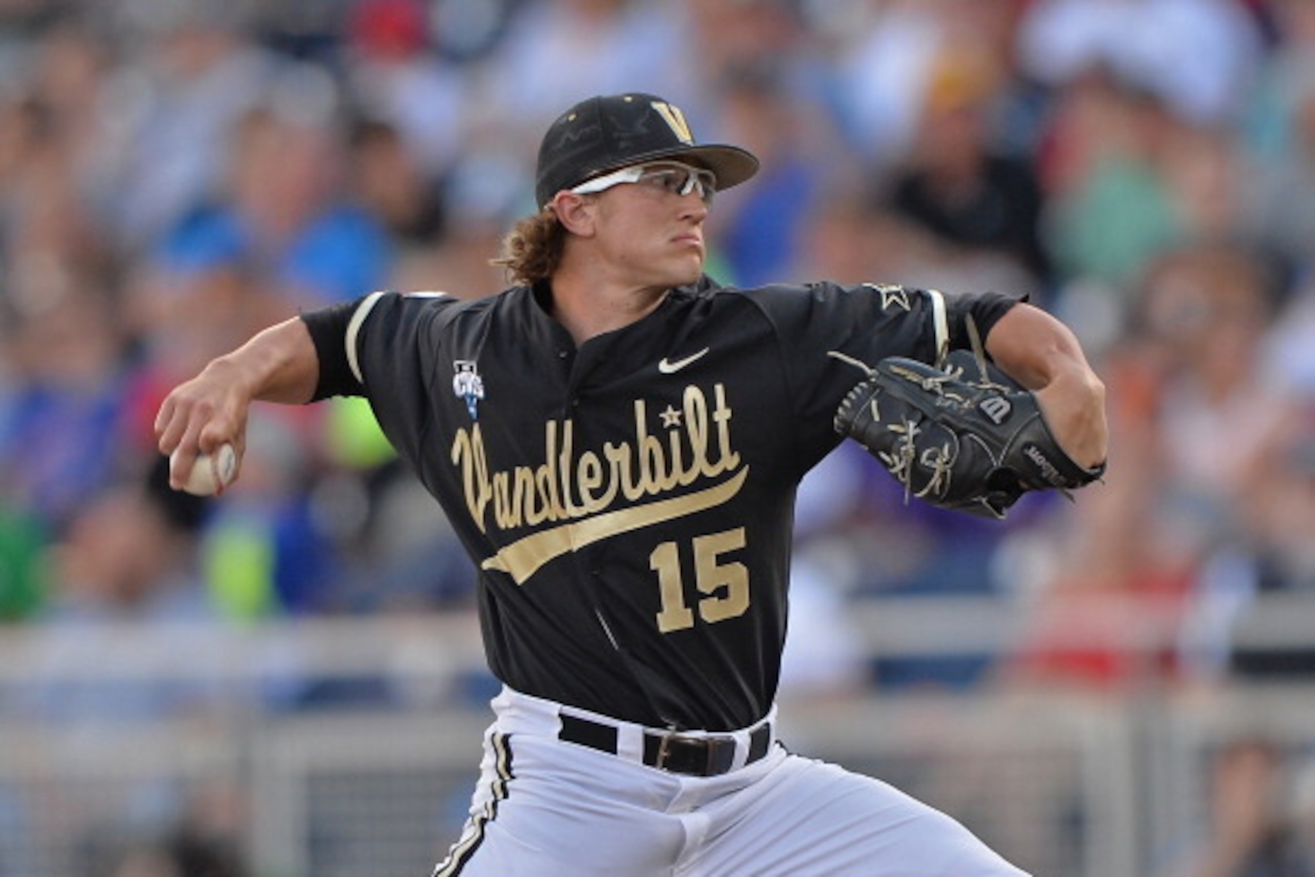 OMAHA, NE - JUNE 25:  Pitcher Carson Fulmer #15 of the Vanderbilt Commodores delivers a pitch against the Virginia Cavaliers in the first inning during game three of the College World Series Championship Series on June 25, 2014 at TD Ameritrade Park in Om
