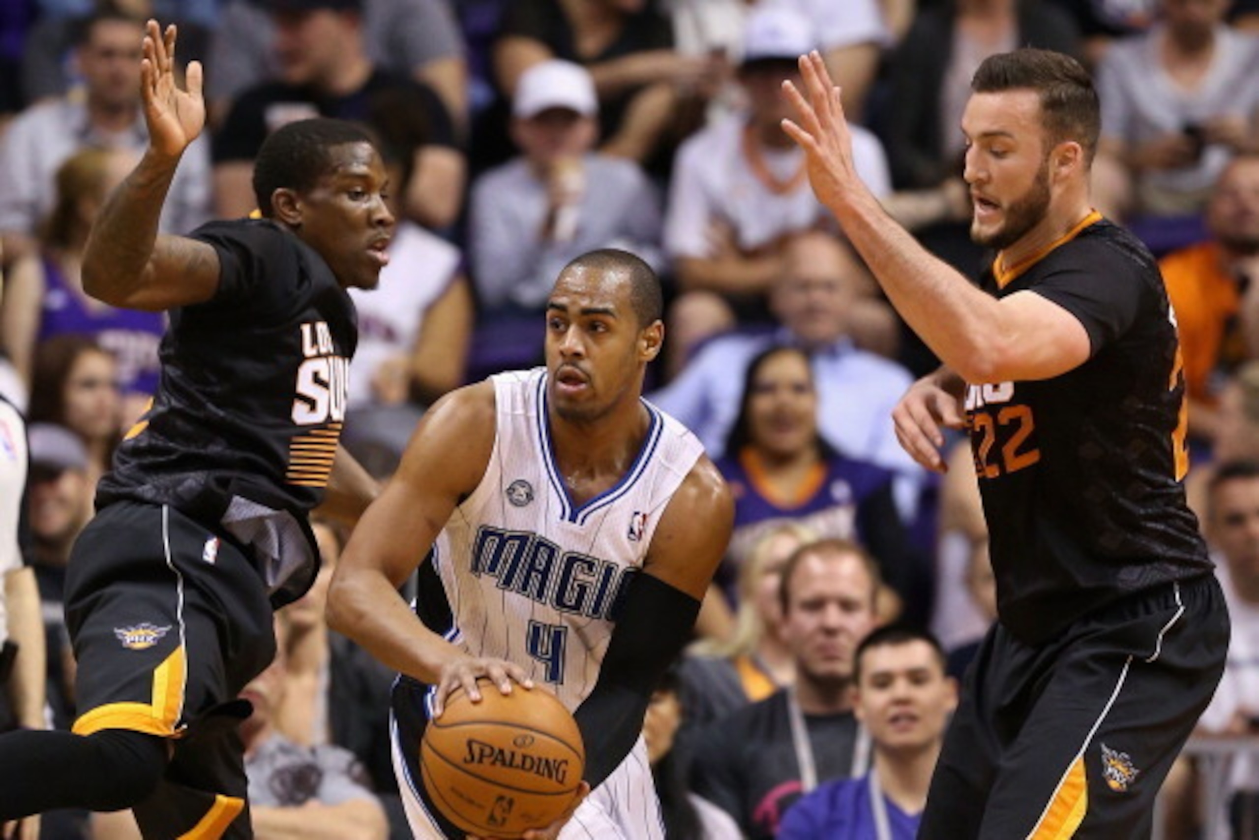 PHOENIX, AZ - MARCH 19: Arron Afflalo #4 of the Orlando Magic looks to pass the ball under pressure from Eric Bledsoe #2 and Miles Plumlee #22 of the Phoenix Suns during the second half of the NBA game at US Airways Center on March 1, 2014 in Phoenix, Ar PHOENIX, AZ - MARCH 19: Arron Afflalo #4 of the Orlando Magic looks to pass the ball under pressure from Eric Bledsoe #2 and Miles Plumlee #22 of the Phoenix Suns during the second half of the NBA game at US Airways Center on March 1, 2014 in Phoenix, Ar