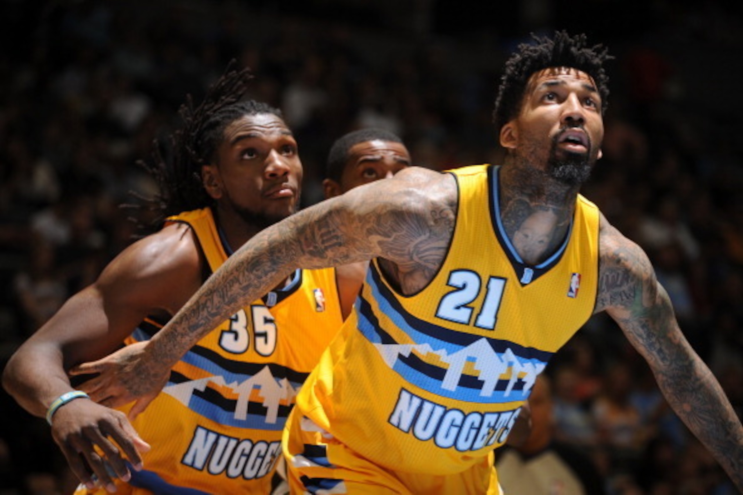 DENVER, CO - April 12: Wilson Chandler #21 and Kenneth Faried #35 of the Denver Nuggets battle for position against the Utah Jazz on April 12, 2014 at the Pepsi Center in Denver, Colorado. NOTE TO USER: User expressly acknowledges and agrees that, by down DENVER, CO - April 12: Wilson Chandler #21 and Kenneth Faried #35 of the Denver Nuggets battle for position against the Utah Jazz on April 12, 2014 at the Pepsi Center in Denver, Colorado. NOTE TO USER: User expressly acknowledges and agrees that, by down