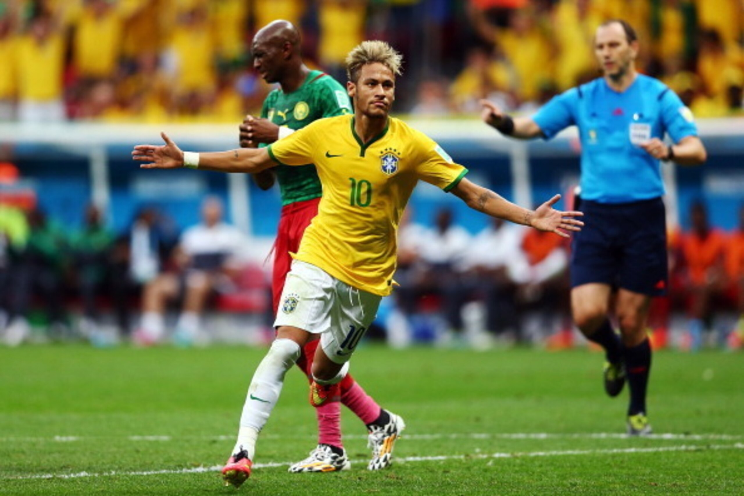 BRASILIA, BRAZIL - JUNE 23:  Neymar of Brazil celebrates scoring his team's second goal and his second of the game during the 2014 FIFA World Cup Brazil Group A match between Cameroon and Brazil at Estadio Nacional on June 23, 2014 in Brasilia, Brazil.  (