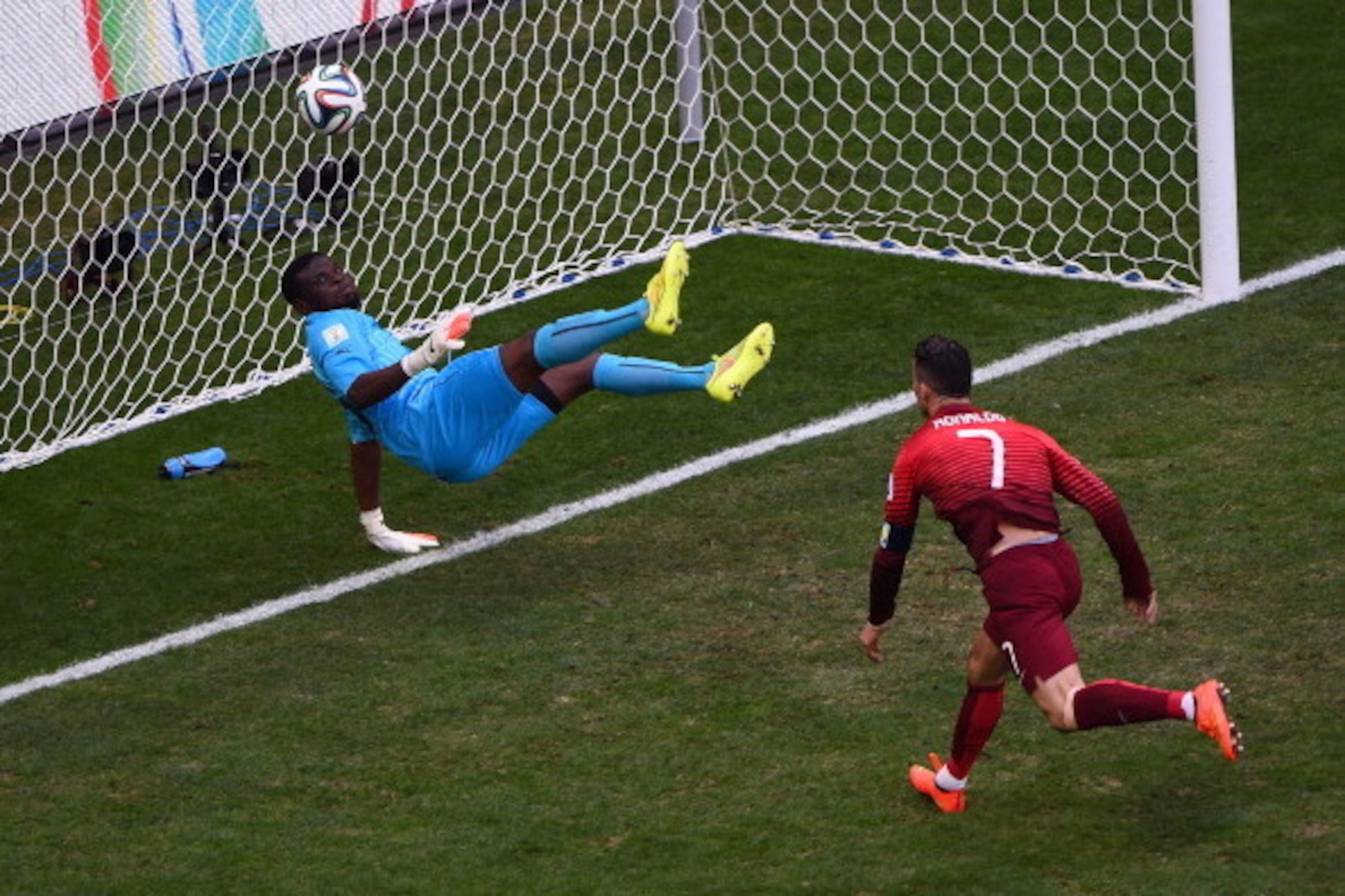 BRASILIA, BRAZIL - JUNE 26:  Goalkeeper Fatawu Dauda of Ghana makes a save at a header at goal by Cristiano Ronaldo of Portugal during the 2014 FIFA World Cup Brazil Group G match between Portugal and Ghana at Estadio Nacional on June 26, 2014 in Brasilia