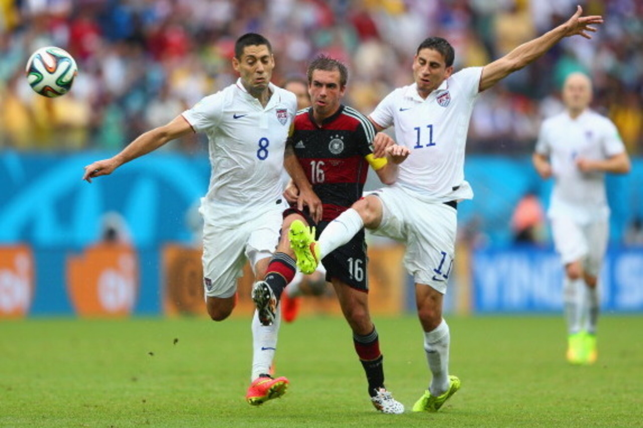 RECIFE, BRAZIL - JUNE 26: Philipp Lahm of Germany is challenged by Clint Dempsey (L) and Alejandro Bedoya of the United States during the 2014 FIFA World Cup Brazil group G match between the United States and Germany at Arena Pernambuco on June 26, 2014 RECIFE, BRAZIL - JUNE 26: Philipp Lahm of Germany is challenged by Clint Dempsey (L) and Alejandro Bedoya of the United States during the 2014 FIFA World Cup Brazil group G match between the United States and Germany at Arena Pernambuco on June 26, 2014