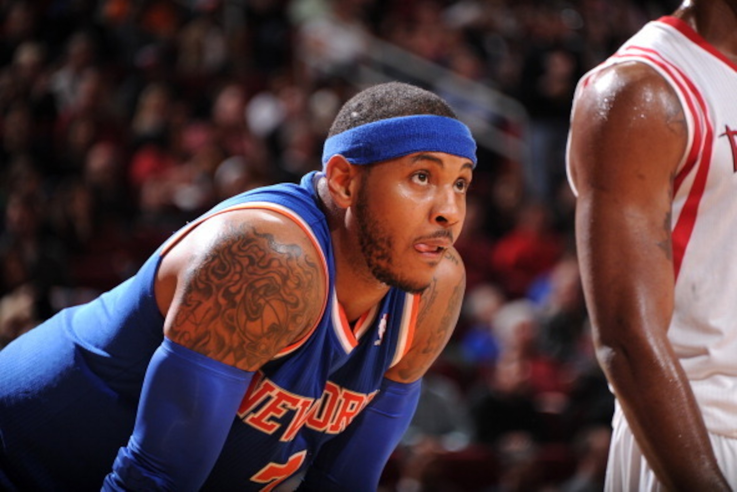 HOUSTON, TX - JANUARY 3:  Carmelo Anthony #7 of the New York Knicks reacts to a play against the Houston Rockets on January 3, 2014 at the Toyota Center in Houston, Texas. NOTE TO USER: User expressly acknowledges and agrees that, by downloading and or us