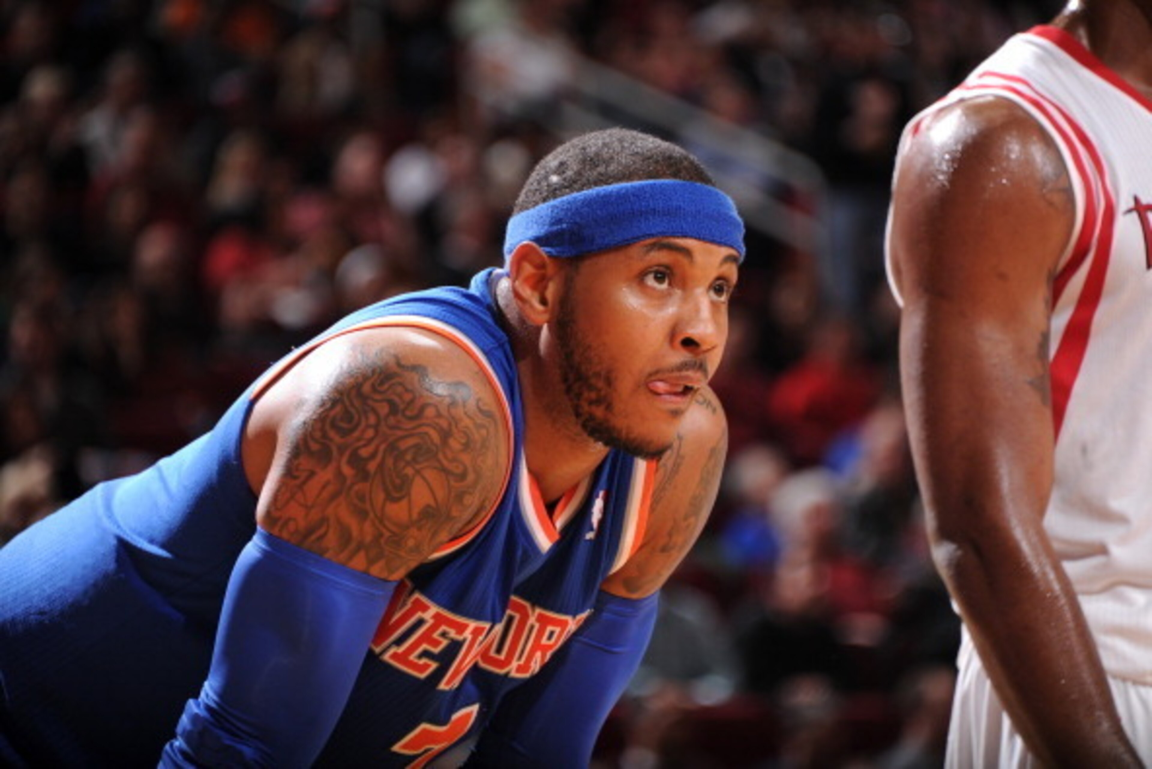 HOUSTON, TX - JANUARY 3:  Carmelo Anthony #7 of the New York Knicks reacts to a play against the Houston Rockets on January 3, 2014 at the Toyota Center in Houston, Texas. NOTE TO USER: User expressly acknowledges and agrees that, by downloading and or us