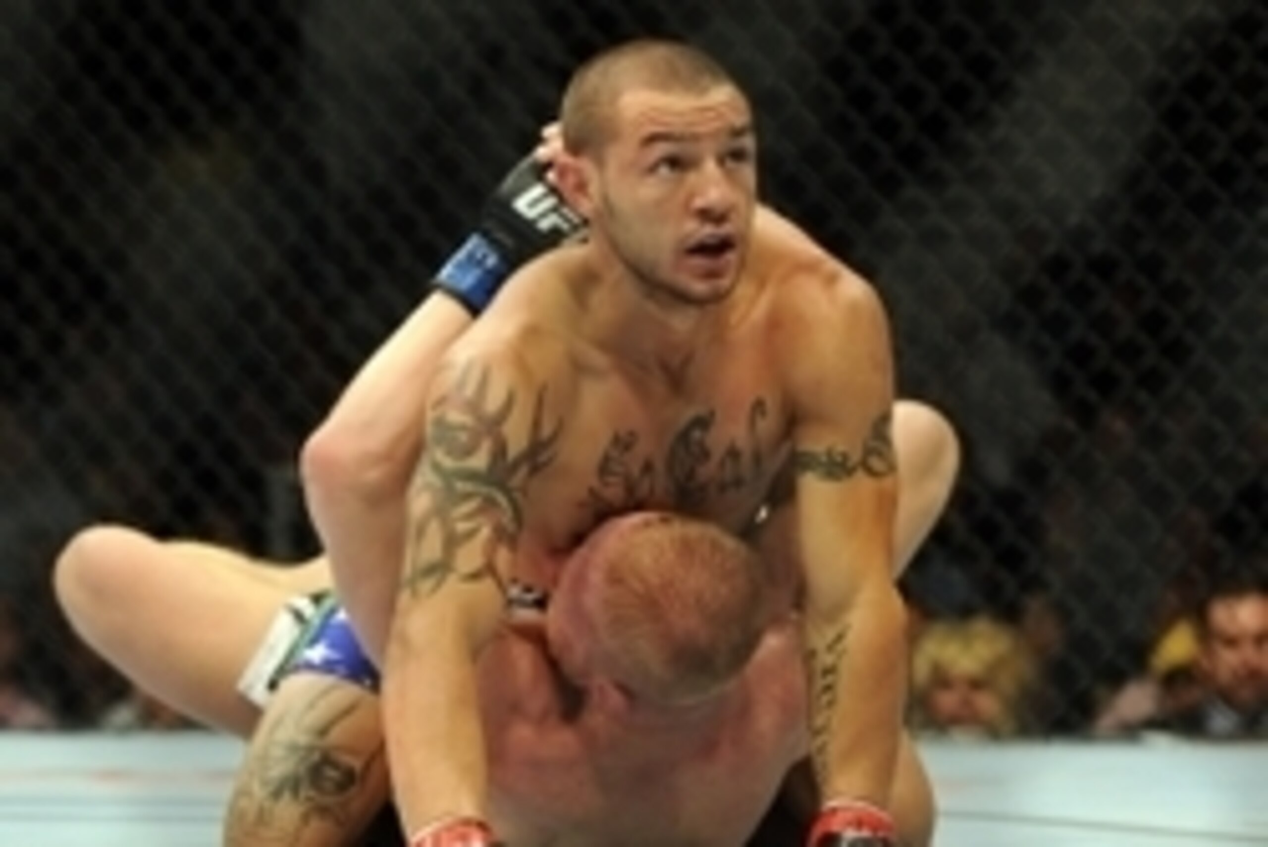 Jul 6, 2013; Las Vegas, NV, USA;  Cub Swanson (red gloves) and Dennis Siver (blue gloves) during their Featherweight Bout at the MGM Grand Garden Arena. Swanson won. Mandatory Credit: Jayne Kamin-Oncea-USA TODAY Sports