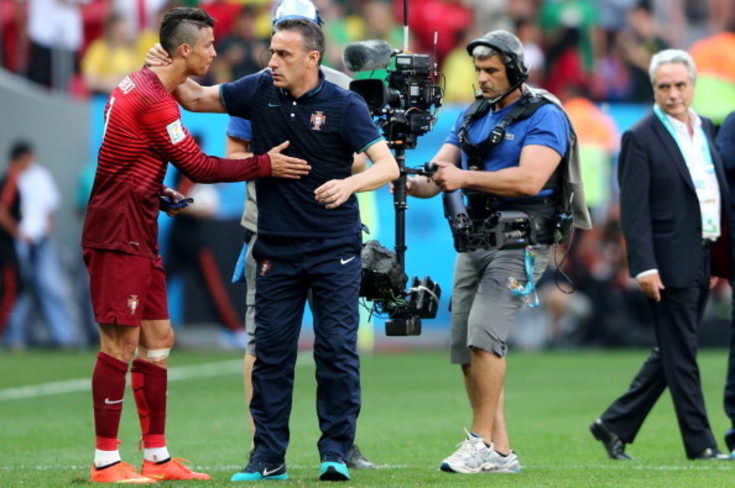 BRASILIA, BRAZIL - JUNE 26:  Head coach Paulo Bento of Portugal consoles Cristiano Ronaldo after the 2014 FIFA World Cup Brazil Group G match between Portugal and Ghana at Estadio Nacional on June 26, 2014 in Brasilia, Brazil.  (Photo by Warren Little/Get