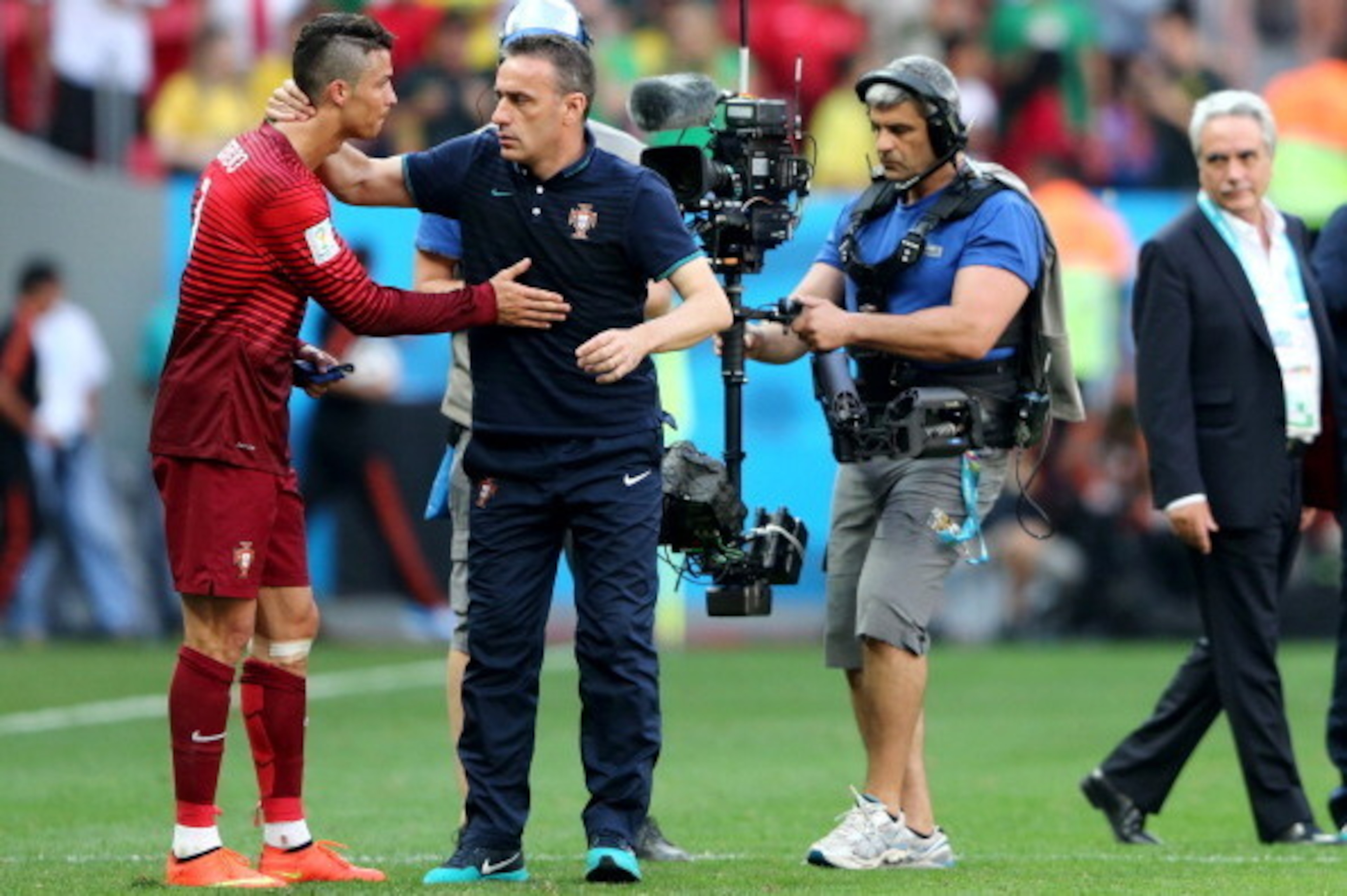 BRASILIA, BRAZIL - JUNE 26:  Head coach Paulo Bento of Portugal consoles Cristiano Ronaldo after the 2014 FIFA World Cup Brazil Group G match between Portugal and Ghana at Estadio Nacional on June 26, 2014 in Brasilia, Brazil.  (Photo by Warren Little/Get