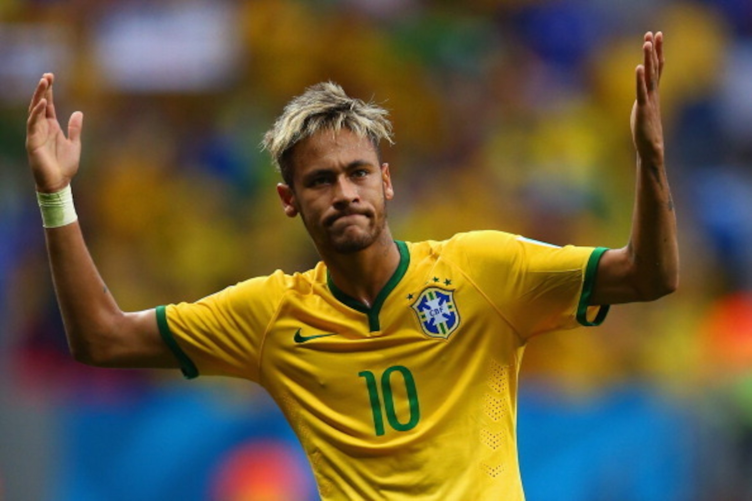 BRASILIA, BRAZIL - JUNE 23: Neymar of Brazil celebrates scoring his team's second goal and his second of the game during the 2014 FIFA World Cup Brazil Group A match between Cameroon and Brazil at Estadio Nacional on June 23, 2014 in Brasilia, Brazil.  (P