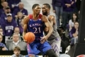 Feb 10, 2014; Manhattan, KS, USA; Kansas Jayhawks center Joel Embiid (21) dribbles against Kansas State Wildcats forward Thomas Gipson (42) during the Jayhawks' 85-82 overtime loss at Fred Bramlage Coliseum. Mandatory Credit: Scott Sewell-USA TODAY Sports