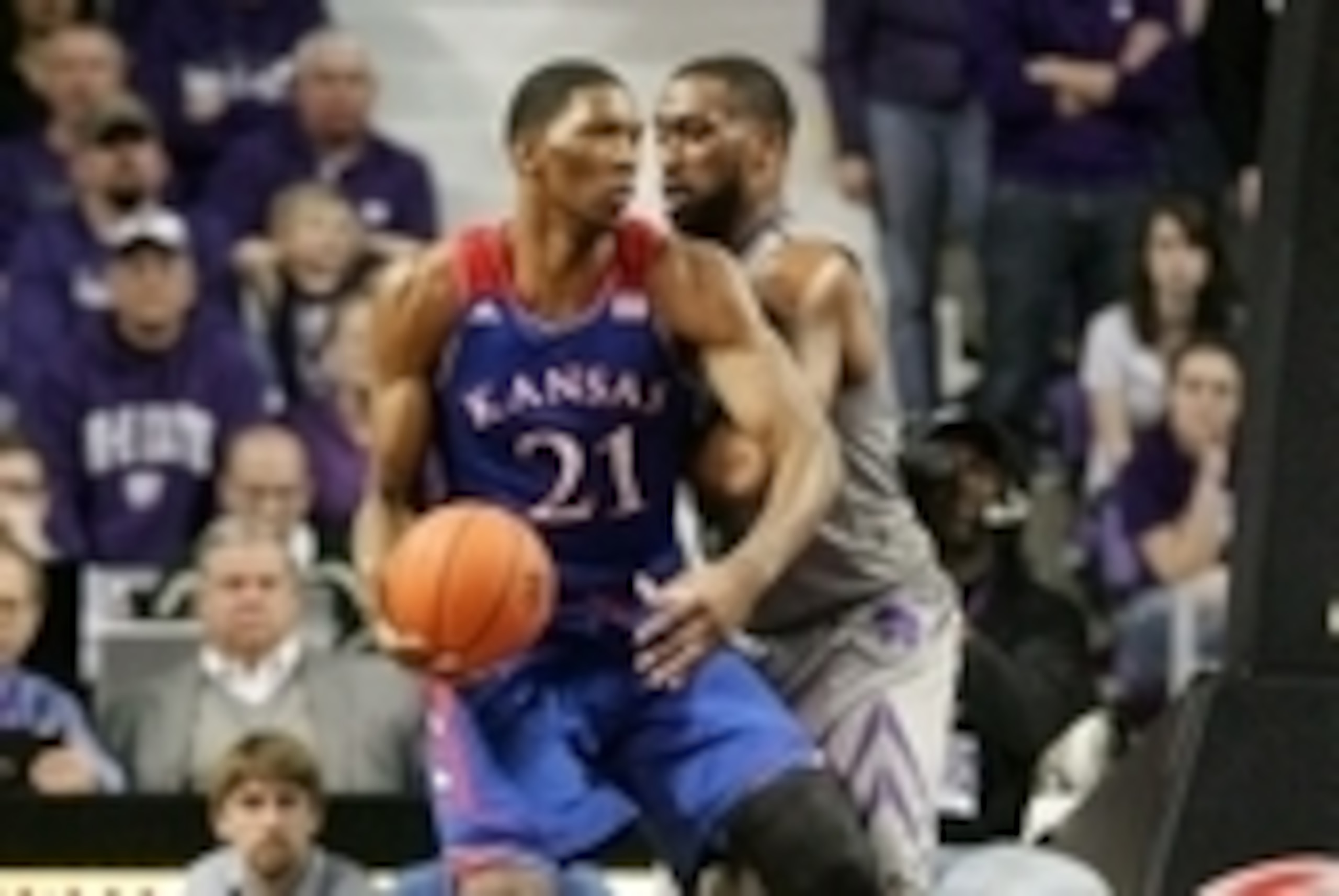 Feb 10, 2014; Manhattan, KS, USA; Kansas Jayhawks center Joel Embiid (21) dribbles against Kansas State Wildcats forward Thomas Gipson (42) during the Jayhawks' 85-82 overtime loss at Fred Bramlage Coliseum. Mandatory Credit: Scott Sewell-USA TODAY Sports