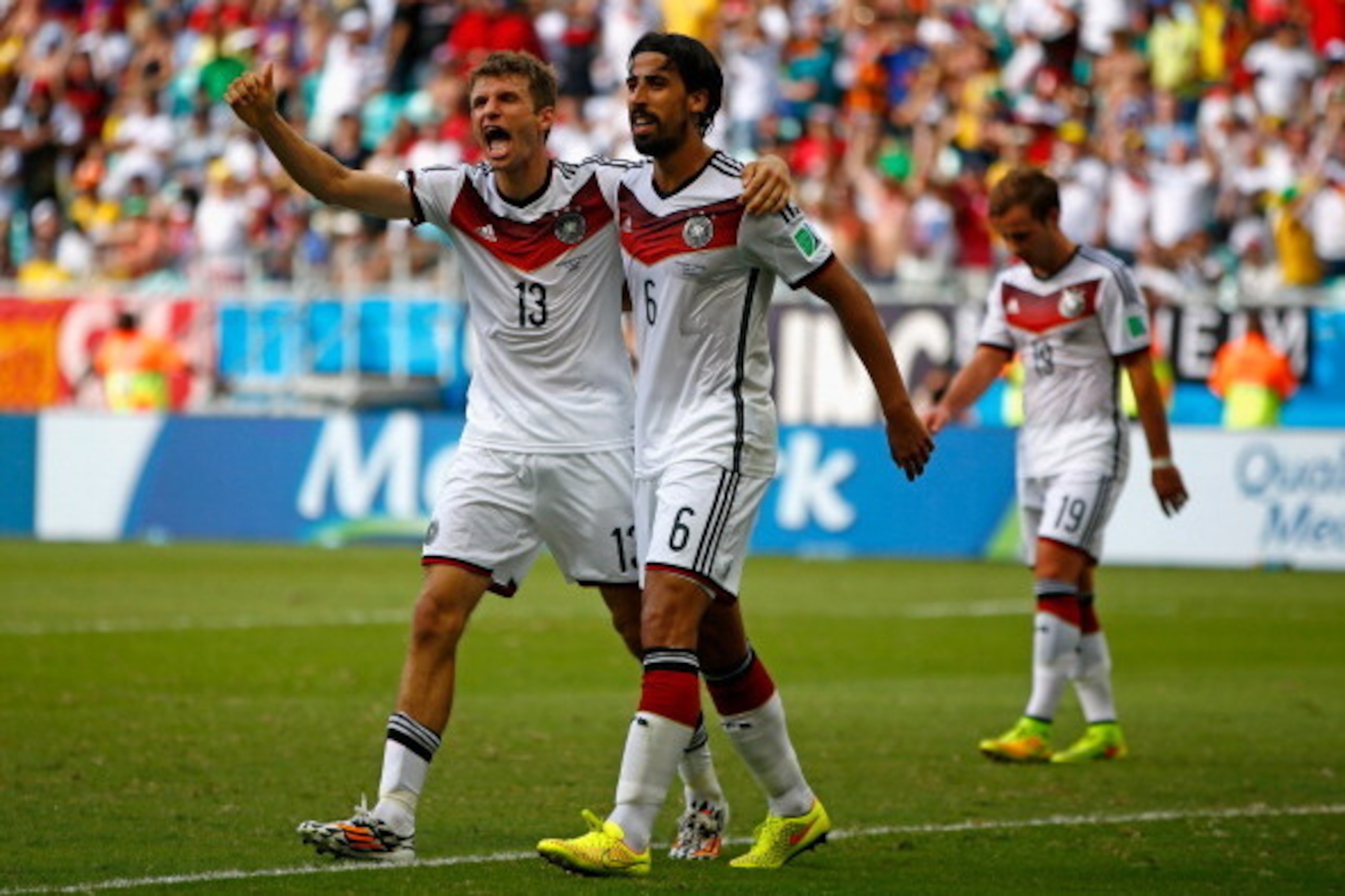 SALVADOR, BRAZIL - JUNE 16:  Thomas Mueller of Germany (L) celebrates scoring his team's fourth goal and completing his hat trick with Sami Khedira during the 2014 FIFA World Cup Brazil Group G match between Germany and Portugal at Arena Fonte Nova on Jun