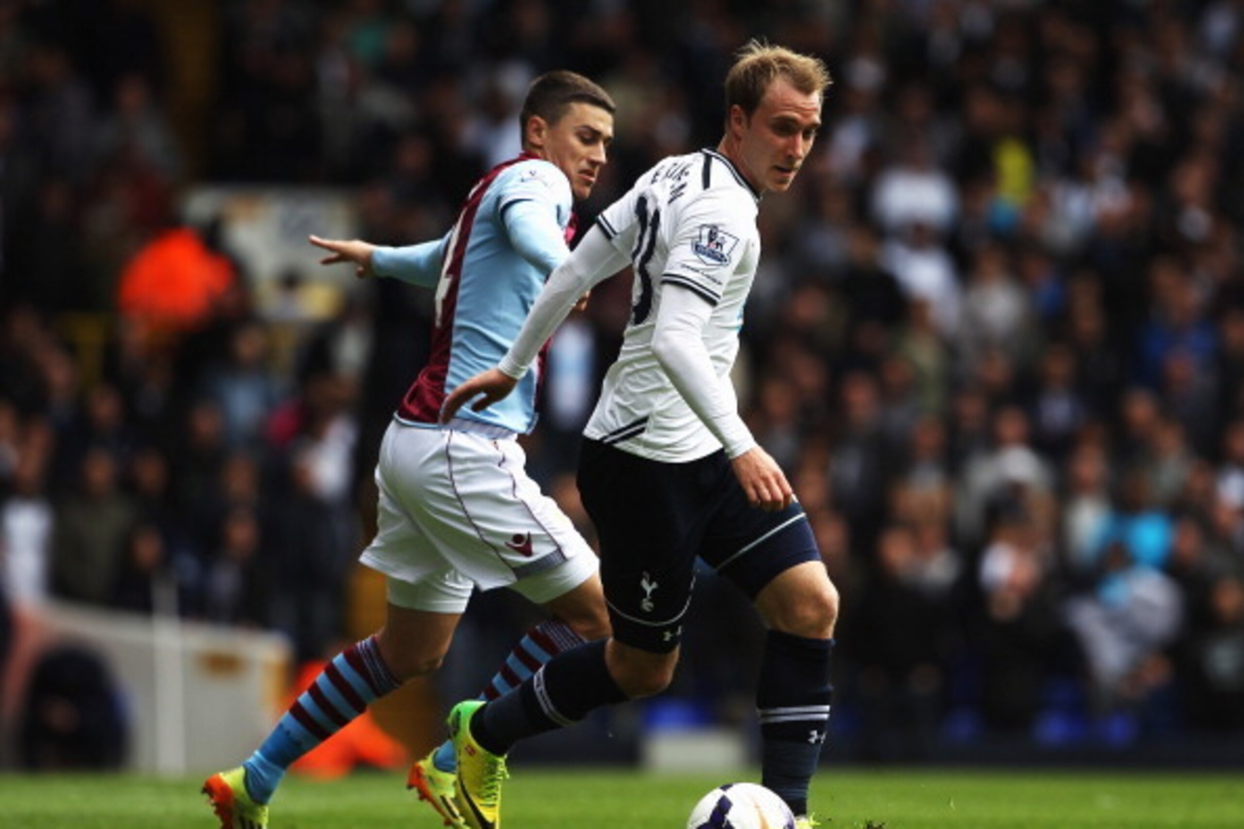 LONDON, ENGLAND - MAY 11: Christian Eriksen (R) of Tottenham Hotspur holds off Matthew Lowton (L) of Aston Villa during the Barclays Premier League match between Tottenham Hotspur and Aston Villa at White Hart Lane on May 11, 2014 in London, England. (P LONDON, ENGLAND - MAY 11: Christian Eriksen (R) of Tottenham Hotspur holds off Matthew Lowton (L) of Aston Villa during the Barclays Premier League match between Tottenham Hotspur and Aston Villa at White Hart Lane on May 11, 2014 in London, England. (P