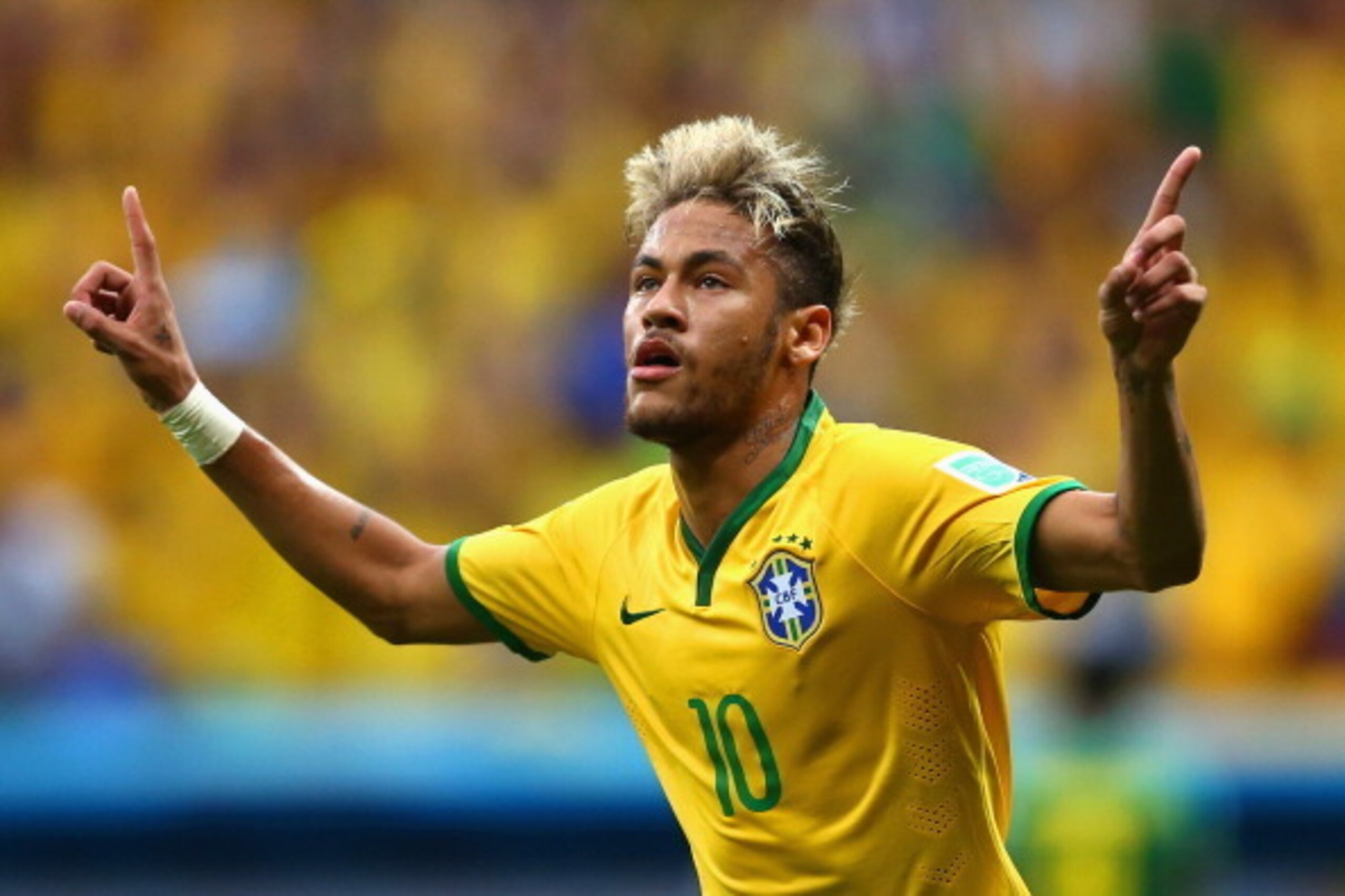 BRASILIA, BRAZIL - JUNE 23:  Neymar of Brazil celebrates scoring his team's second goal and his second of the game during the 2014 FIFA World Cup Brazil Group A match between Cameroon and Brazil at Estadio Nacional on June 23, 2014 in Brasilia, Brazil.  (